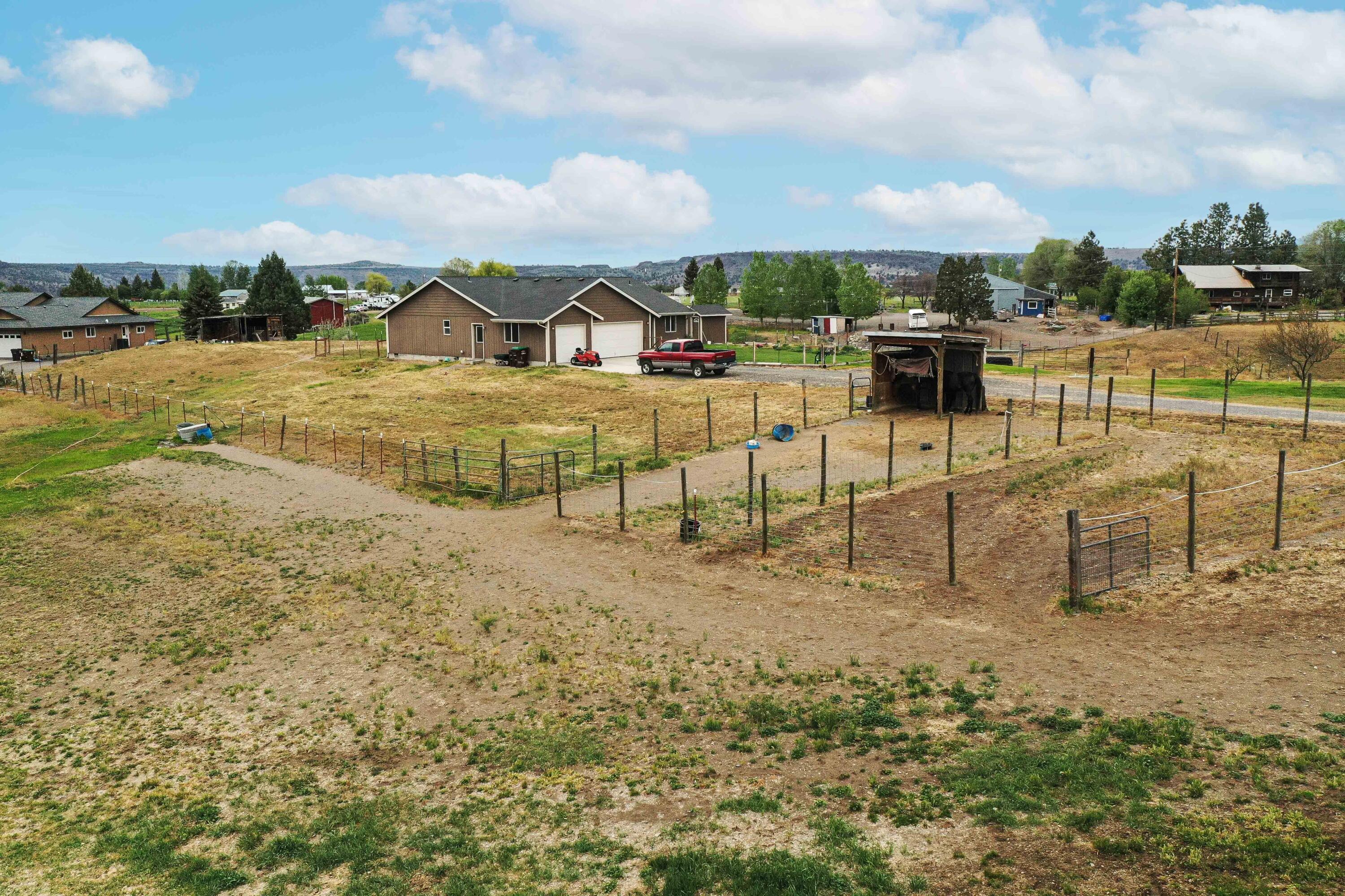 HUGE PRICE REDUCTION!! Single level quietly situated on 4.85 irrigated acres. Welcome home to this cozy 3 bedroom 2 bathroom with an office. This property is fenced and partially cross-fenced and ready for your horses and all other furry friends. This won't last long, schedule a showing with your favorite realtor today!!
