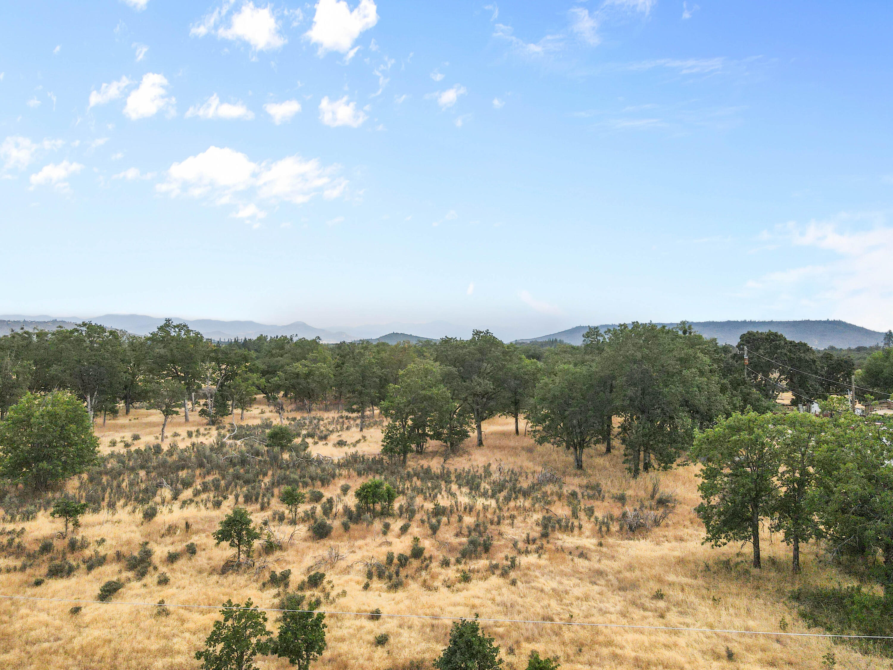 Sams Valley land, located about 8 miles to the town of Eagle Point, OR and about 17 miles to the nearest Hospitals and city amenities of Medford. This bare land offers 5 usable acres that is primarily flat, with utilities at the road. Buyers will need to do their own due diligence.  Call today to view this great listing!!