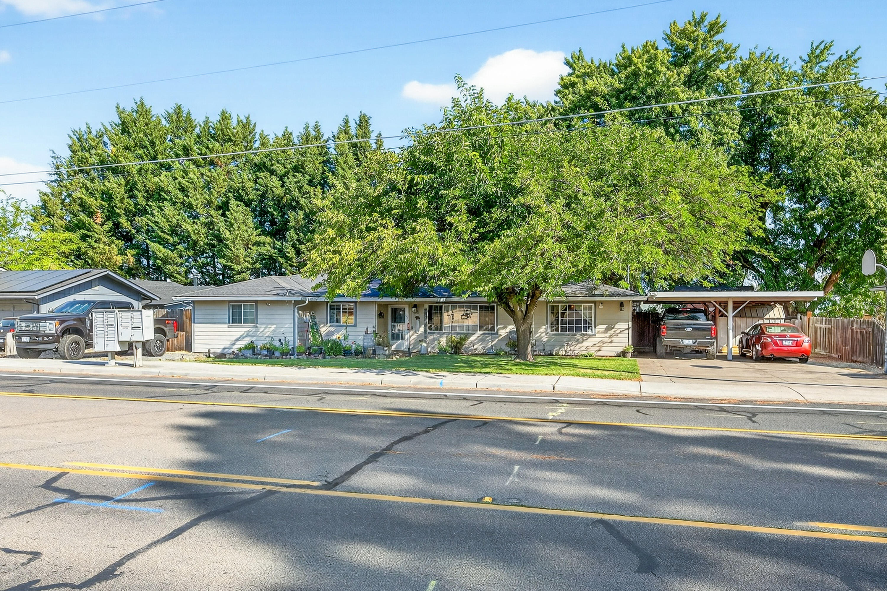 Versatile 4-bedroom SW Medford property! Utilize bonus room as 5th bedroom, family room or flex space. Larger than average city property of .28 level acres. Parking for 4+ vehicles at main driveway. Second driveway w/double gate to addtl. parking & RV power hook up. Inviting interior w/gas fireplace in living room. Updated kitchen w/newer stainless steel appliances. Dedicated laundry room w/utility sink. Sizable bonus room w/exterior access. New 95% efficient gas furnace & AC unit installed Dec 2021. Upgraded plumbing- all new PEX pipe interior water lines, fittings, supplies, and shut-offs installed Jun 2025! Invoices attached. Backyard offers both plentiful sunshine & generous shade from the mature trees. No activity left behind- you'll have full use of 3 large sheds for hobbies, large patio w/gazebo for entertaining, hot tub, thriving garden, catio, established chicken coop & room for more! Located in a residential neighborhood near schools, parks, and shopping. Call to view!