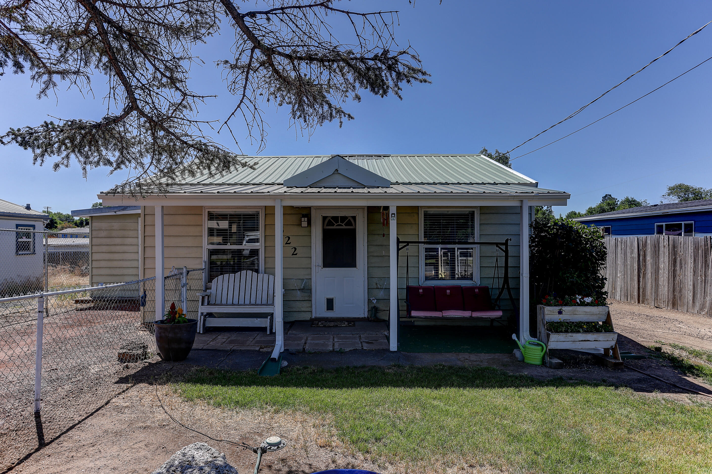 Don't miss out on this updated 2 bed, 1 bath, 696 sf. cottage! Inside you will find new butcher block countertops, tile backsplash, microwave & a new glass top stove is on order & will be installed by closing. There is ductless heating & AC unit, new laminate flooring & updated bathroom. Property is fully fenced w/ RV parking, shed & metal roof! Home includes a refrigerated, washer & dryer. Call today for a showing!