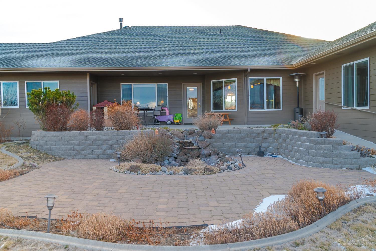 This unique home offers expansive Cascade mountain views and immaculate landscaping. 6 total bedrooms, 4 Master Suites, 2nd largest suite is off the kitchen & has private entrance. Dual furnaces & water heaters. Extra deep three car garage, formal dining, open kitchen to family room & formal living too. Over 2 acres w/space for RV garage & shop. Enjoy fine living in beautiful Madras!