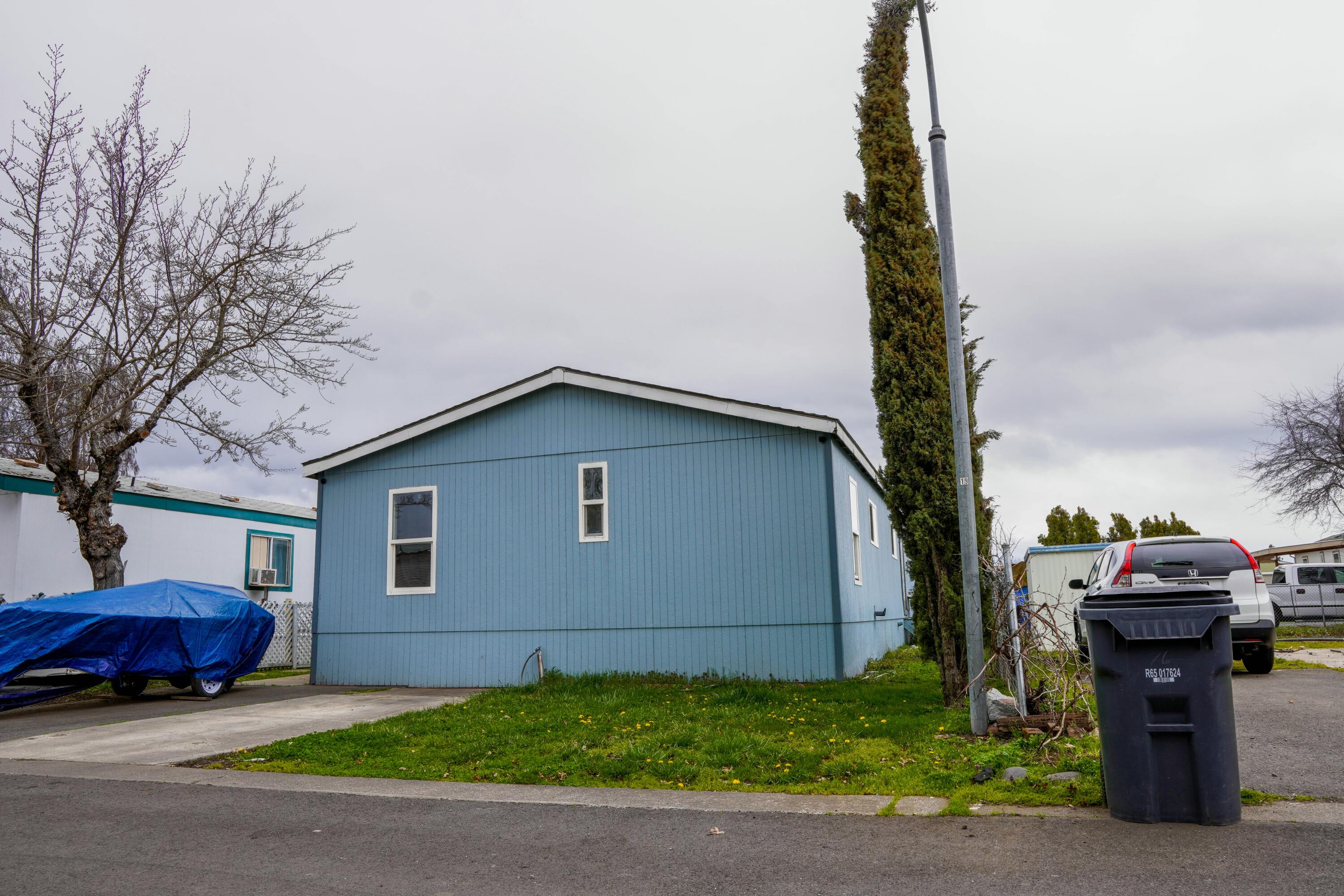 OWNER CARRY AVAILABLE!! Opportunity knocks! This 3-bedroom, 2-bath home offers 1,344 square feet of potential, ready for your vision and personal touch. Whether you're an investor or a buyer looking to build equity, this property is a true fixer with solid bones and tons of upside. The layout is spacious and functional, featuring a large living area, indoor laundry, and a generous kitchen that comes complete with all appliances. Outside, you'll find covered parking for two vehicles and a storage shed for added convenience. Located in an all-ages community park. Bring your toolbox and imagination—this is a chance you don't want to miss!