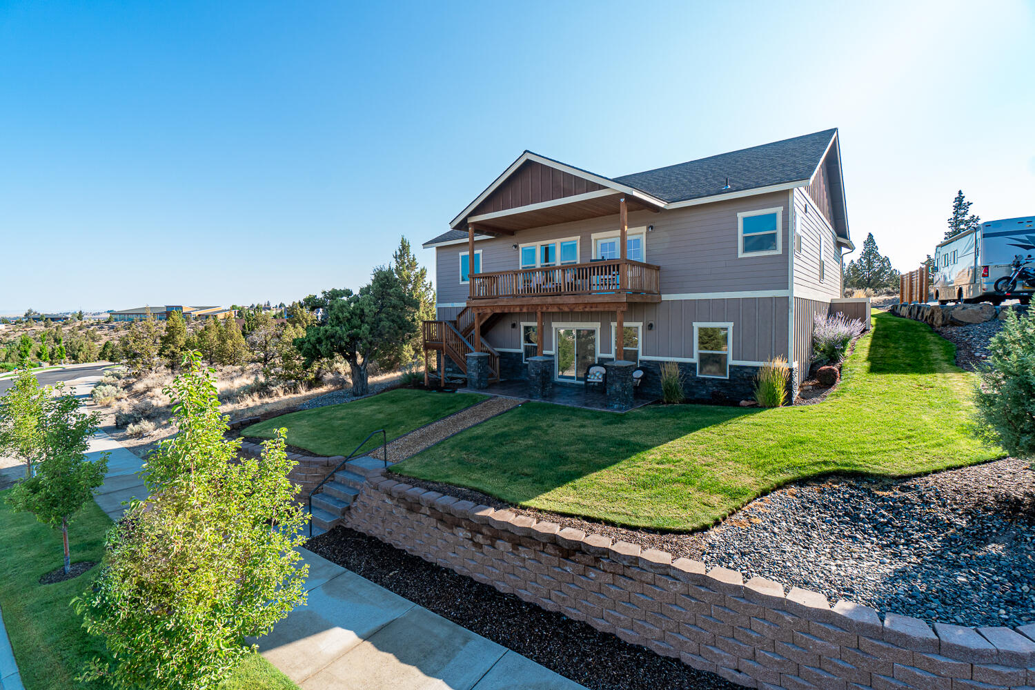 Enjoy spectacular Cascade Mtn Views from the upper side of Yarrow. Over 3,000 sf of well appointed living space w/a great room layout & main level primary suite. Inviting entry w/covered front porch & low maintenance landscape. Vaulted living space w/engineered wood look flooring, spacious dining & bright kitchen. Tons of counter space & storage, pantry, breakfast bar seating & slab granite. Dining area extends to a second level deck for year round enjoyment. Primary  suite offers dbl vanities, granite counters & walk in closet. Two guest rooms & full bath also on main level. Daylight basement features another bed, bath, storage & huge bonus area for family room, home gym, 5th bedroom (add window), laundry room, mechanical room & so much more! Opens to a private patio & easily used for a rental suite or extended family. Oversized dbl garage w/opener, sprinkler system for the landscaping, paved alley access, community park & close to the water park & all amenities. Don't miss!
