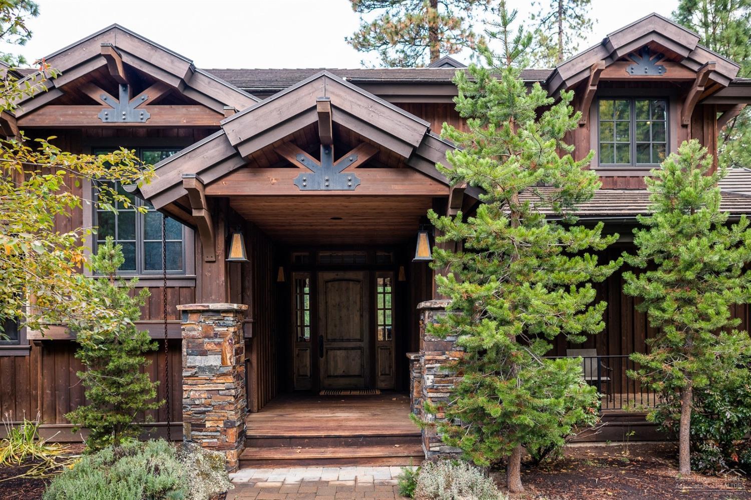 Location, style, attention to detail and masterful construction find harmony in Black Butte Ranch. Nestled on just over 1.5 acres with lush pondersosa pines and common area is this stunning 4 bedroom, 4 bath estate designed by renowned architect Steve VanSant and built by Sunforest Construction. This home is adorned with high quality finished including a great room with two story rock fireplace, floor to ceiling windows, expansive wood vaulted ceilings - all creating impressive scale and volume. Highlights also feature large gourmet chef's eat in kitchen with professional oven and appliances, center kitchen island/breakfast bar with wine refrigerator, impressive backsplash and hardwood flooring. The dual master suites each offer decadent baths with private access to two of the four spacious decks, two extra large guest rooms, two laundry rooms (one upstairs and one down) exercise room and wine cellar/storage as well.