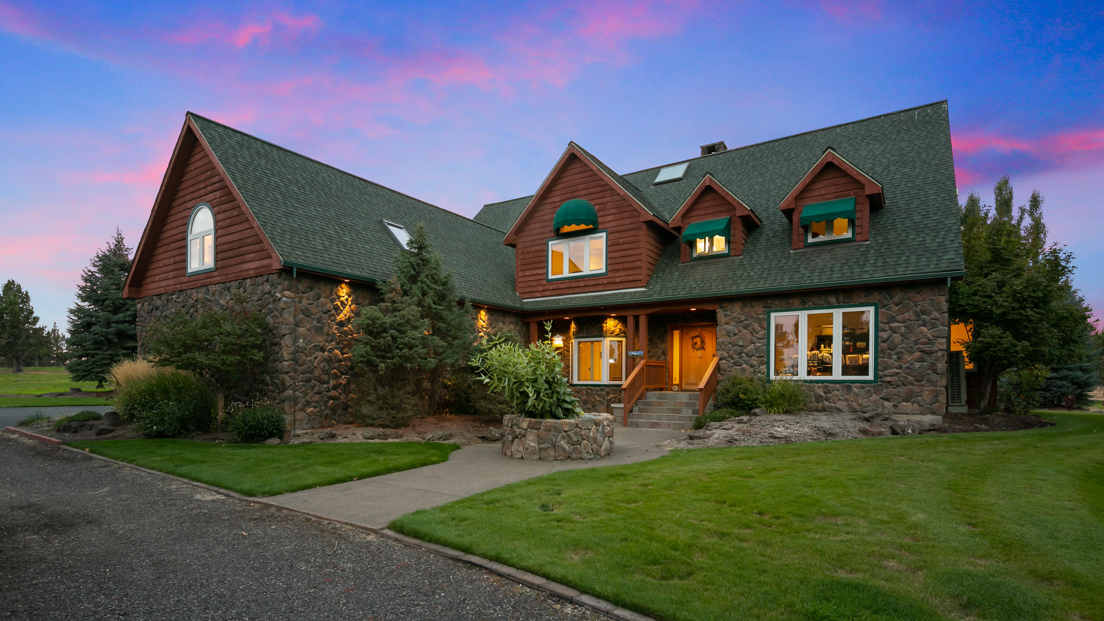 Gorgeous horse property on 38.95 acres with 14.5 irrigated acres. The 4,035 sq. ft. custom home has a beautiful great room that overlooks a fantastic pond, 5 bedrooms, 3.5 baths, office, second master upstairs and so much more. Enjoy the amazing 6 stall custom 36'x100' barn with heated tack room, viewing room, full kitchen and bath, veterinarian room, double shower & wash rack, automatic waterers, and high quality steel fencing. There is a covered 60' round pen with lights and a brand new 144' X 72' covered arena. The irrigation system is installed on timers with K-line and is hassle-free, two shops, loafing sheds, entry gate & so much more. Ride directly off the property on to BLM! This peaceful private property is perfectly located just minutes from town. Don't miss out on this premiere equestrian estate!