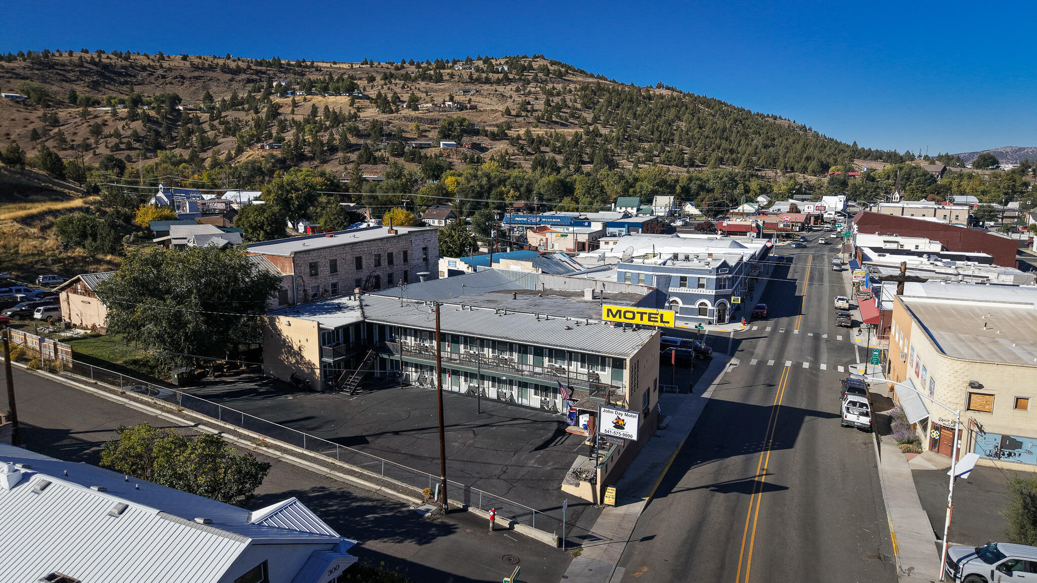 Exceptional Opportunity in John Day, Oregon

Discover a 14-unit, non-franchised motel that is both profitable and ready for immediate operation. This business can be managed by either an owner or a manager due to its manageable size. The property includes six single queen bed units, eight double queen bed units, & a manager suite. It is highly rated on Bookings & Google.
Recent upgrades include new signage, heating and air conditioning units, refrigerators & microwaves, 32'' flat-screen TVs, new beds and flooring, and updated shower surrounds, bedding, and towels. The amenities feature an outdoor seating area, a guest firepit and BBQ, and a small garage/storage space.
John Day offers a wealth of public land and recreational activities, such as fossil beds, gold panning, hiking, 4-wheeling, snowmobiling, high mountain lakes, hunting, and more. The current owners are absentee, and there's a manager on-site who is willing to stay or help train. Owner will carry.