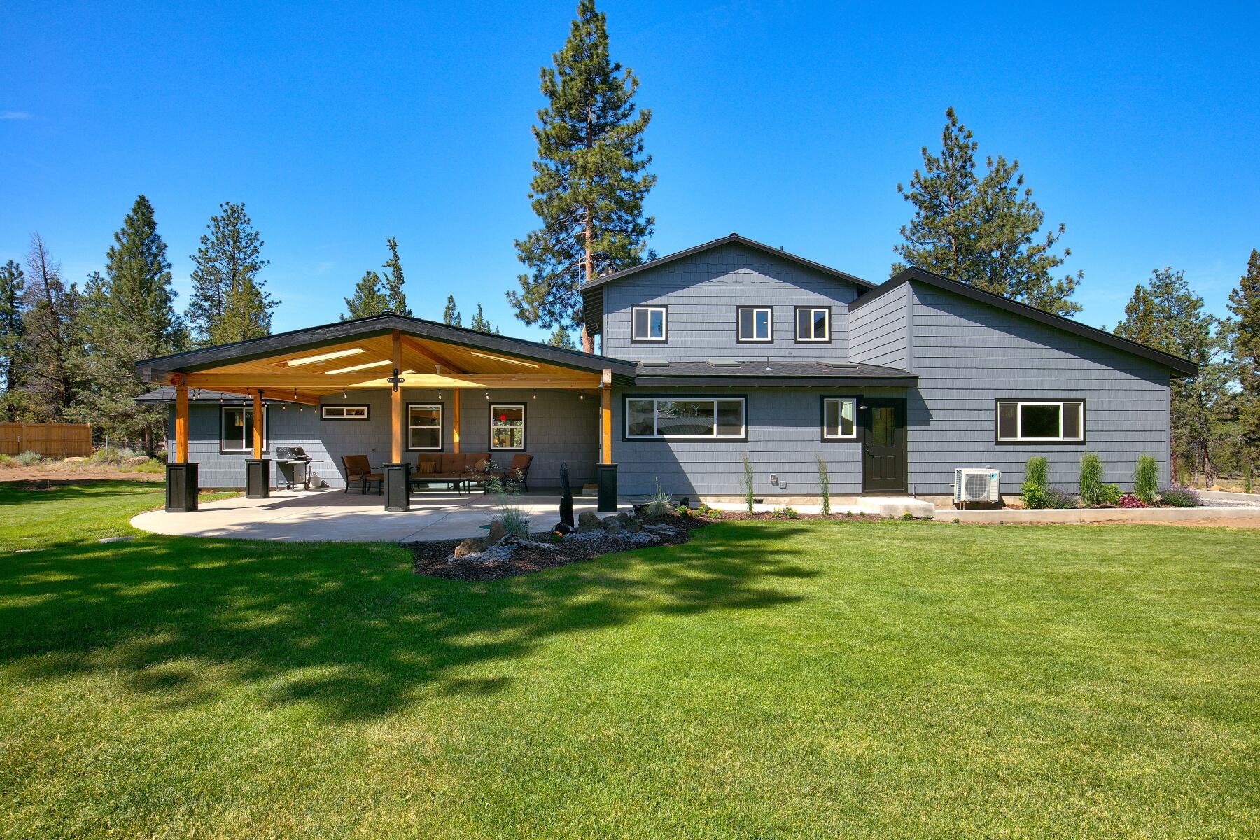 Incredible opportunity for a custom home on 4.6 acres in the pine trees minutes from Sisters. Traditional style home is 3057 sq ft, 3 bedrooms, 2.5 bathrooms with an open floor plan, vaulted ceilings and great room ready for entertaining. Chef's kitchen is big with quality appliances, solid countertops, breakfast bar, farm sink, insta hot, custom cabinets and pantry. Home includes dining room, private master suite with peekaboo Cascade Mountain Views, office/utility room, wood stove, sauna and attached garage with apoxy floors. Wonderful outdoor living with covered patio and hot tub in the private back yard. The shop includes: 2 studios with bathrooms, RV storage 50 amp power and full hookups, attached garage, work area and storage. Barn/Equipment storage, 2 containers and woodshed. This home, shop and property has been completely updated, is move in ready and a must see!