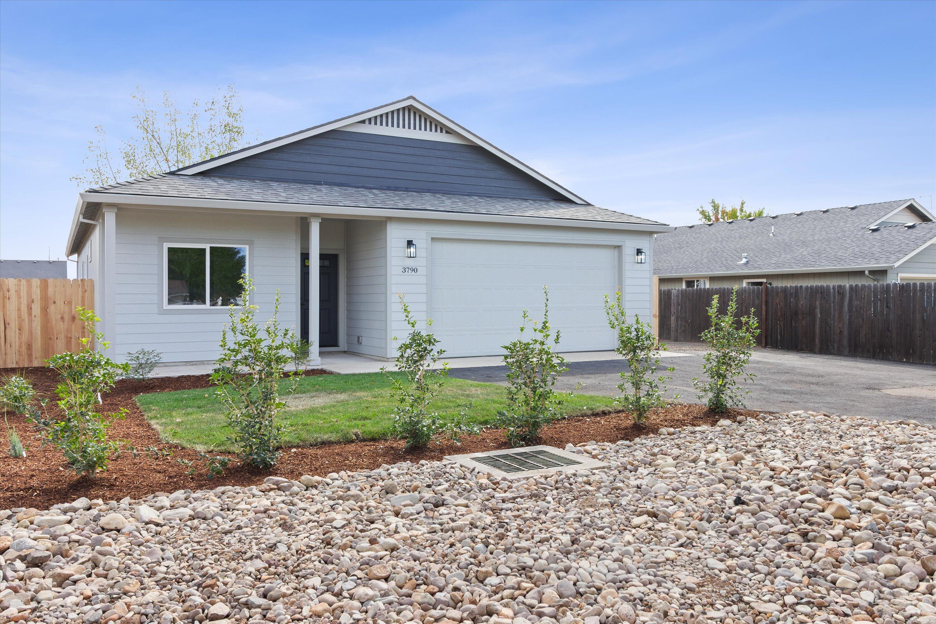 PRICE REDUCED + LENDER INCENTIVES! BRAND NEW with top-of-the-line finishes! Come and see this 3 bedroom 2 bathroom home located in a wonderful area of town and has deep RV parking for your toys! This new construction home is set to be completed in Mid-August. Vaulted ceilings, upgraded LVP flooring, carpet in the bedrooms, luxury vinyl tile in the bathrooms and laundry room. The home features an open floor plan concept and a kitchen with granite counter tops, upgraded knotty alder finger pull cabinets with slow closing hinges, black colored lighting and plumbing fixtures and all matching appliances that will be black or chrome. This home is energy efficient (energy trust of Oregon certified) and perfect for a first time buyer or investor looking for a solid rental property. It also comes with FULL landscaping and fencing at no cost to the buyer! Inquire to find out how you can qualify for ZERO percent down financing or down payment assistance! This won't last long!