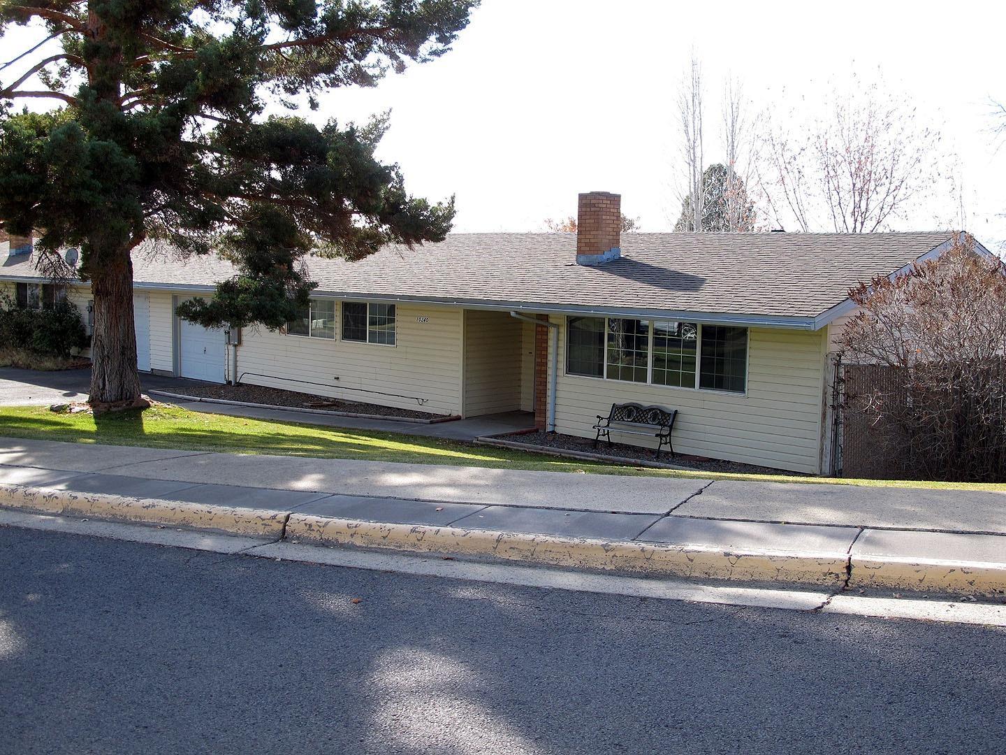 This 3 bedroom home with almost 1350 sq ft with many updates including newer appliances, laminate floors, remodeled bathroom with tile floors, and fresh paint inside. The front yard is nicely landscaped with inground sprinklers. The large back yard is fully fenced with covered RV parking and power , 16 X 12 Storage shed with power and alley access. This home is located in a gated community with a community center and community park and hosts community evens. This home should qualify for 100% USDA financing and is ready to go now so don't wait.