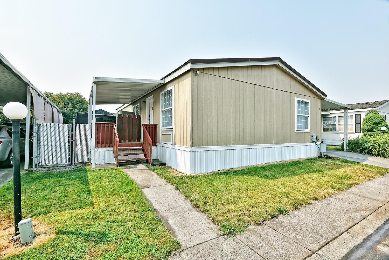 Looking for an inexpensive, quality home in the fantastic Peachwood Village Mobile Home Park? If so, this is the one for you! This 1994 built property features 3 bedrooms, 2 full bathrooms, 1188 sq ft, private backyard, spacious deck, open living room, large master bedroom, and so much more! Hot tub included as well! Detached shed, carport for additional off street parking, and a newer metal roof are just a few of the many amenities this property has to offer! Space rent is $395 per month. Call for all showings and additional information!