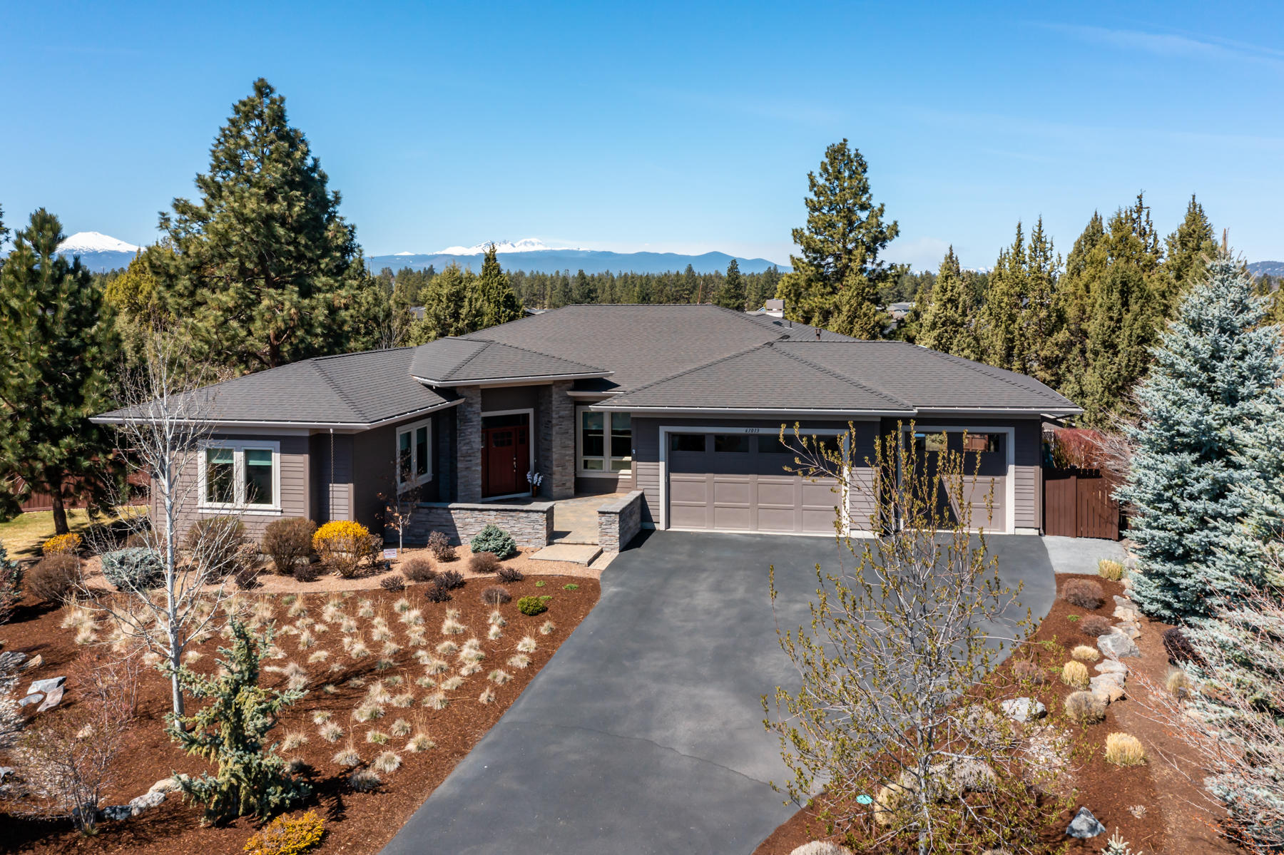 Every detail and finish was chosen with care in this beautiful prairie style home custom built by award winning Choice One builders. The stunning acacia wood floors, granite counters and gorgeous Cascade mountain views will welcome you into this amazing space. All living area is on the main level: 3 bedrooms, a spacious office, 2.5 baths, kitchen, dining and great room. The level below has an expansive bonus room and bathroom and are perfect for entertaining. The home has state of the art wireless tech: a smart thermostat, security system, automated door locks, smart lighting, whole house audio/stereo, apple TVs and 4k smart TVs which are all included. The fully fenced almost half acre lot has low maintenance landscaping, mature trees and a large storage shed.  Don't miss the pass through garage - ideal for storing a small RV.  This pleasing home has been immaculately maintained and lives like a new house, come see all it has to offer!  

Total house square footage is 4,006 sq ft.