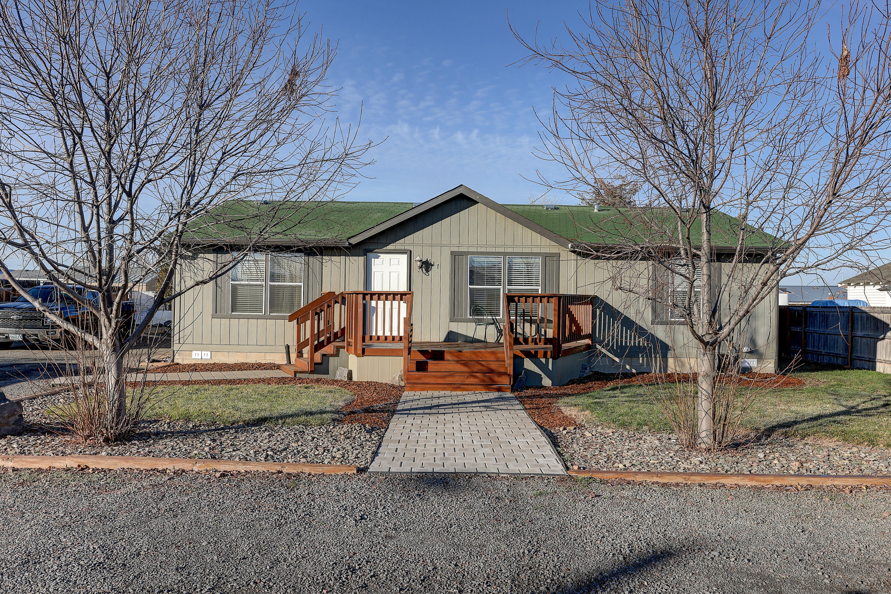 This well kept Manufactured home shows the love and pride that was put into it. From the freshly painted decks to the beautiful hand painted cherry blossom tree on the Livingroom wall. It is located in a tight-knit neighborhood in Culver where the neighbors all look out for each other and are available to lend a hand.