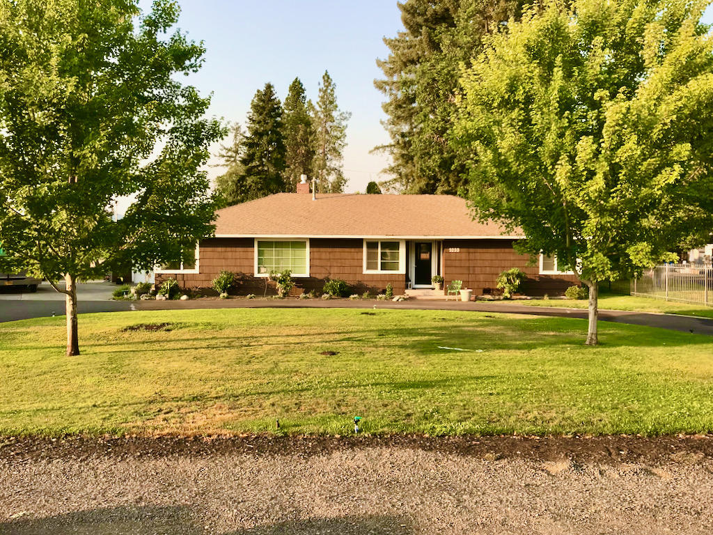 This gorgeous 1950's home sits on just over a half acre with beautiful mature landscaping and sprinkler system with irrigation well, an above ground pool surrounded by a gorgeous custom deck, a covered patio, large fenced in yard, fenced in oversized RV parking with full hook-ups and sewer dump.  There is also a brand new, beautiful, 20 x 40 shop with 110 amp service, 220v outlet, led lighting, epoxy floors, and so much more!  The home features brand new hardwood flooring, built-ins, custom barn doors, new paint, new gas insert fireplace, new bathrooms, custom entertainment center built-in (included fitted TV), and new electric panels.  Too much to list!  Simply a beautiful property, and home, schedule your tour today!