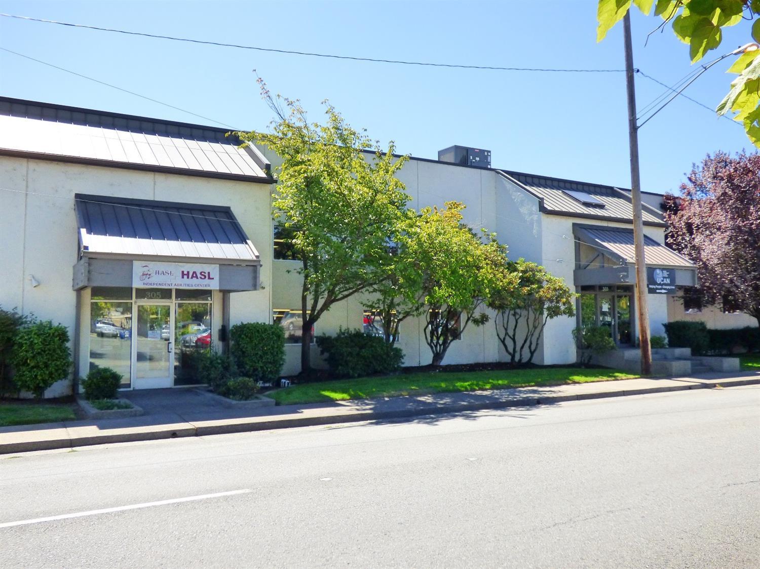 Fantastic opportunity in downtown Grants Pass, priced to sell at only $26/sq foot, 23,086 sq foot, general commercial building in high exposure location close to restaurants and shopping with dedicate parking lot. Potential for a variety of uses, including call center, office building, general retail, law firm, school, church, gym or whatever you dream of. Property includes two tax lots. Building is two connected but fully separate units, each with their own utilities. Back entrance is wheelchair accessible. Building can be configured in a multitude of ways, but has several smaller offices, large open conference spaces, a break room with kitchen, storage rooms, elevator, wheelchair accessible bathrooms and more. One non-profit agency currently leases half of the space. Owner may consider lease option.