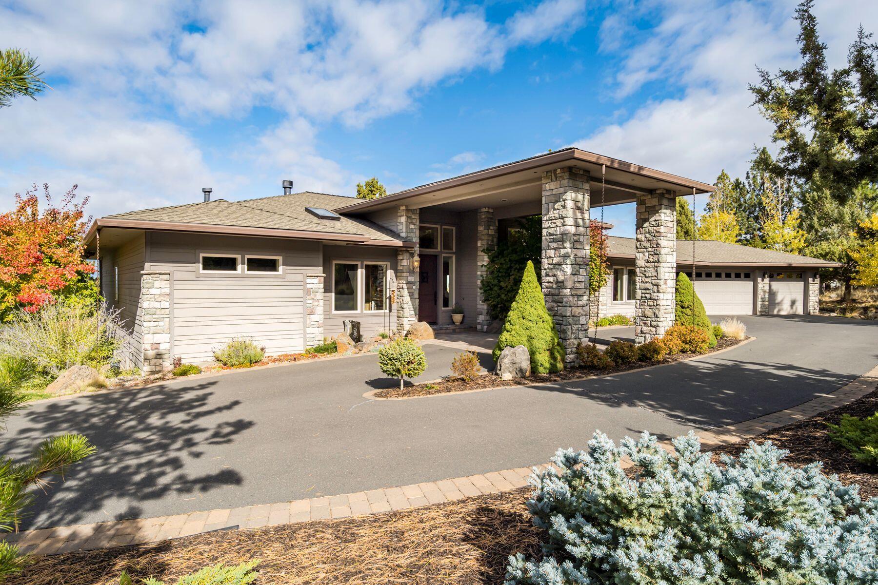 Elegant SINGLE LEVEL Awbrey Butte home with phenomenal Cascade views from Mt. Jefferson to Mt. Bachelor! Situated on an immaculate .58/ACRE corner lot, this Northwest Contemporary offers a thoughtful floorplan throughout featuring 3BR/3.5BA + Home Office. Light-filled Great Room with soaring ceilings, gas fp and huge windows overlooking the breathtaking Cascade Mountains, opens to formal Dining Rm and separate bar area...an entertainer's dream! Spacious cook's kitchen w/slab granite, ample storage and generous working island also functions as bar for informal dining. Private Primary Suite features more fabulous views, gas fp, dual vanity and walk-in closet. 2 additional en suite bedrooms offer excellent separation from Primary Ste. Home Office w/ 2 built-in desks and cabinetry. Expansive back paver deck, water features and beautiful landscaping. 3 car garage for all your Bend gear plus add'l storage under deck. Enjoy fantastic proximity to Westside schools, amenities and trail systems.