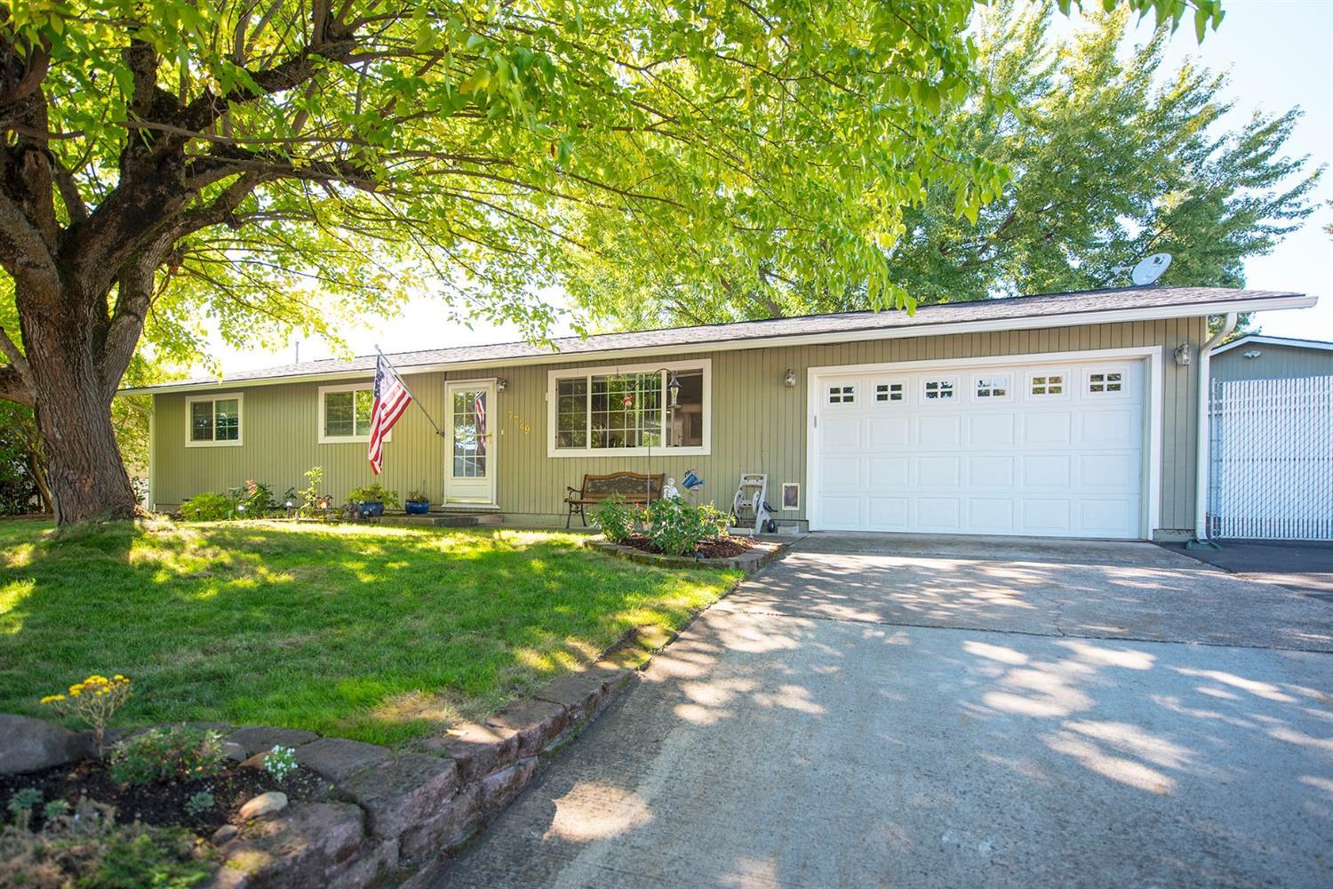 The hard work has already been done on this updated ranch style home that features 3 BR's and 2 BA's on a nice sized .23 acre lot that is move in ready. Did we mention the oversized detached finished shop fully equipped with power? This well cared for home with mature landscaping and large shade trees features updated laminate and tile floors throughout, with updated fixtures, new bathroom vanities, and an oversized laundry room with extra storage between the kitchen and the attached garage. The newly remodeled kitchen has wood tile floors, Corian countertops and island, newer appliances, and a surplus of gorgeous maple cabinets. Outside you will enjoy a large fenced backyard complete with areas to garden and a raised patio deck perfect for entertaining with plenty of shade and privacy for relaxing on those warm summer afternoons, extra parking, RV Parking with electrical hook-ups. You have to see this home to appreciate all it has to offer.