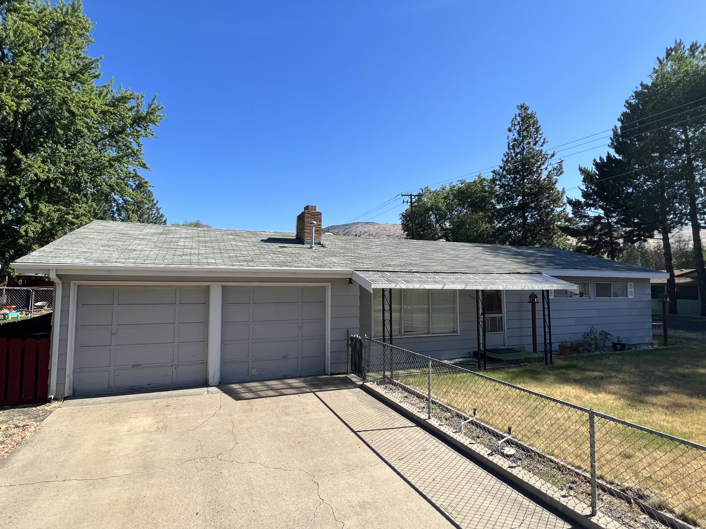 This suburban home is located on  the corner of Shasta Way and Homedale Road.  It is fenced front and back with sprinklers and two nice sized storage sheds in the backyard.  There is a covered concrete patio right outside of the enclosed patio room.  The home has air conditioning for the warm months and has heat for the cooler months.  The corner lot should allow for rear yard access just in case you might need RV access.  This property has KID irrigation when available.