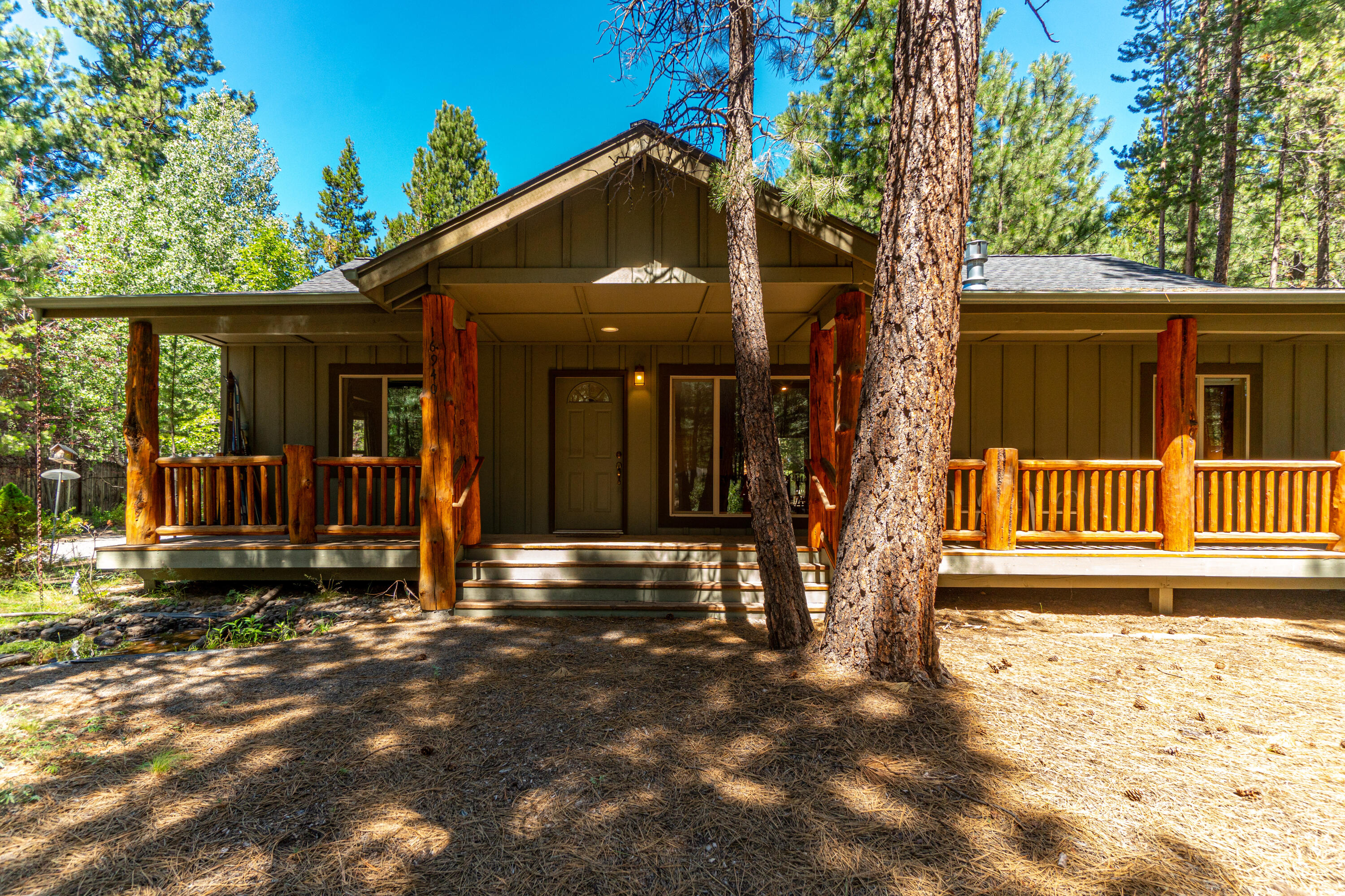 Just minutes from the river, this Bend home is ideal for enjoying all activities that Central Oregon has to offer. Walk into the great room with log beams, skylights and a propane river rock fireplace. V-G fir French doors to primary-suite, walk-in closet with built-ins. Charming bonus room plus a sun - room with AC and heat, large laundry room with a generous pantry. You will have plenty of room for toys with a triple car garage. Enjoy the private outdoor oasis that feature a pond with small bridge, mature trees and fenced back yard for added privacy. Seller to credit 10k to buyer at closing to buy down interest rates points or use towards closing costs. No commission paid on seller concessions.