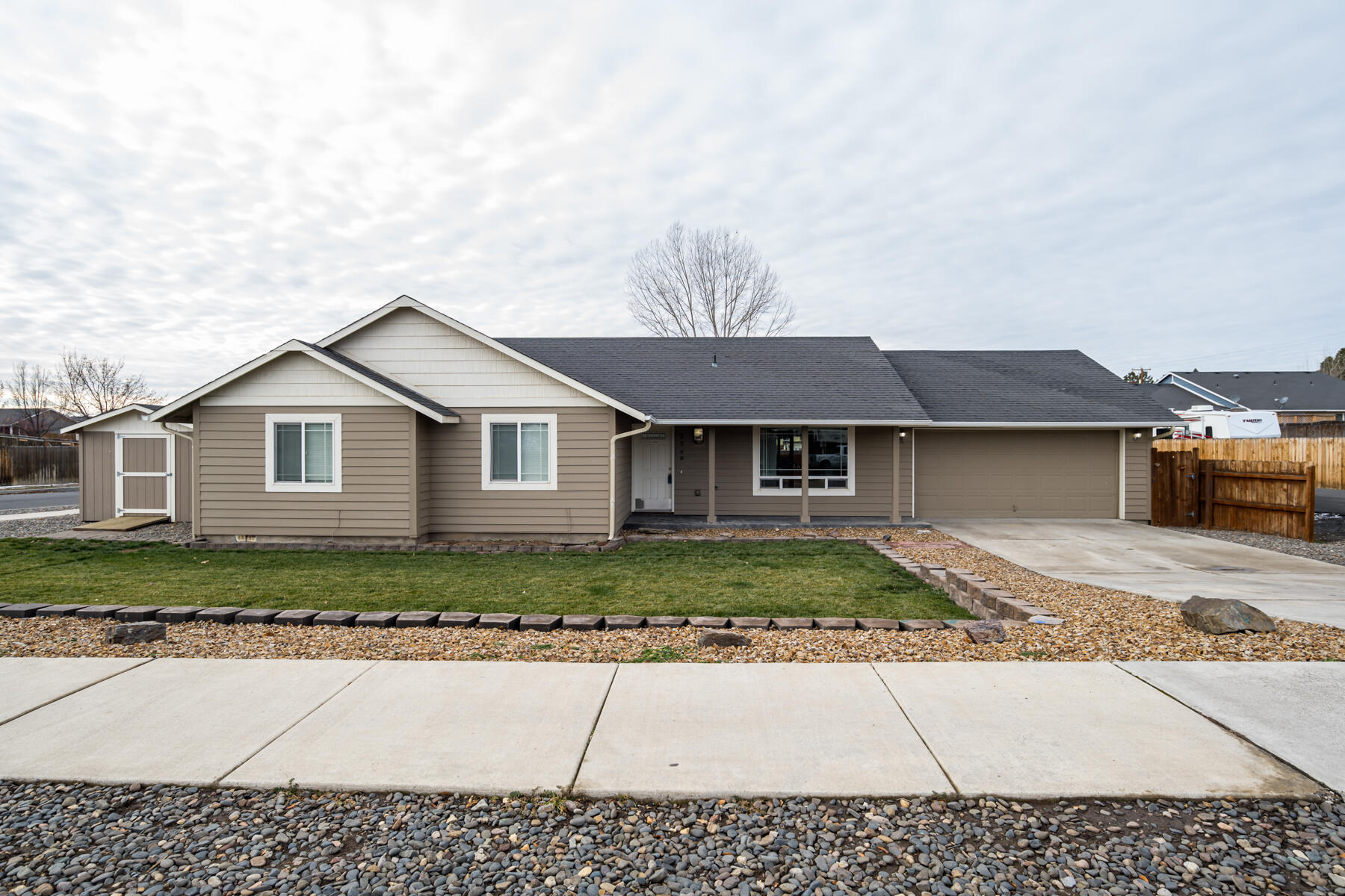 Welcome to Deer Ridge Subdivision!  This Ranch Style home sits on a corner lot, just off of the beaten path,  yet close to everything. The covered front porch and stamped concrete walkway invite evenings on the porch. Featuring main level living with vaulted ceilings and great room. The kitchen is light and bright with an abundance of cabinet storage. Off the great room is the covered back patio with a fully fenced and landscaped yard waiting for you to perfect your BBQ skills.. There is the convenience of a storage shed for your gardening tools. The interior features a large primary suite, almost 1400 square feet of living space. Two additional bedrooms and guest bath complete the interior. There is a 2 car garage just off the kitchen. See list of improvements attached. This is a great home, call your agent today to tour!
