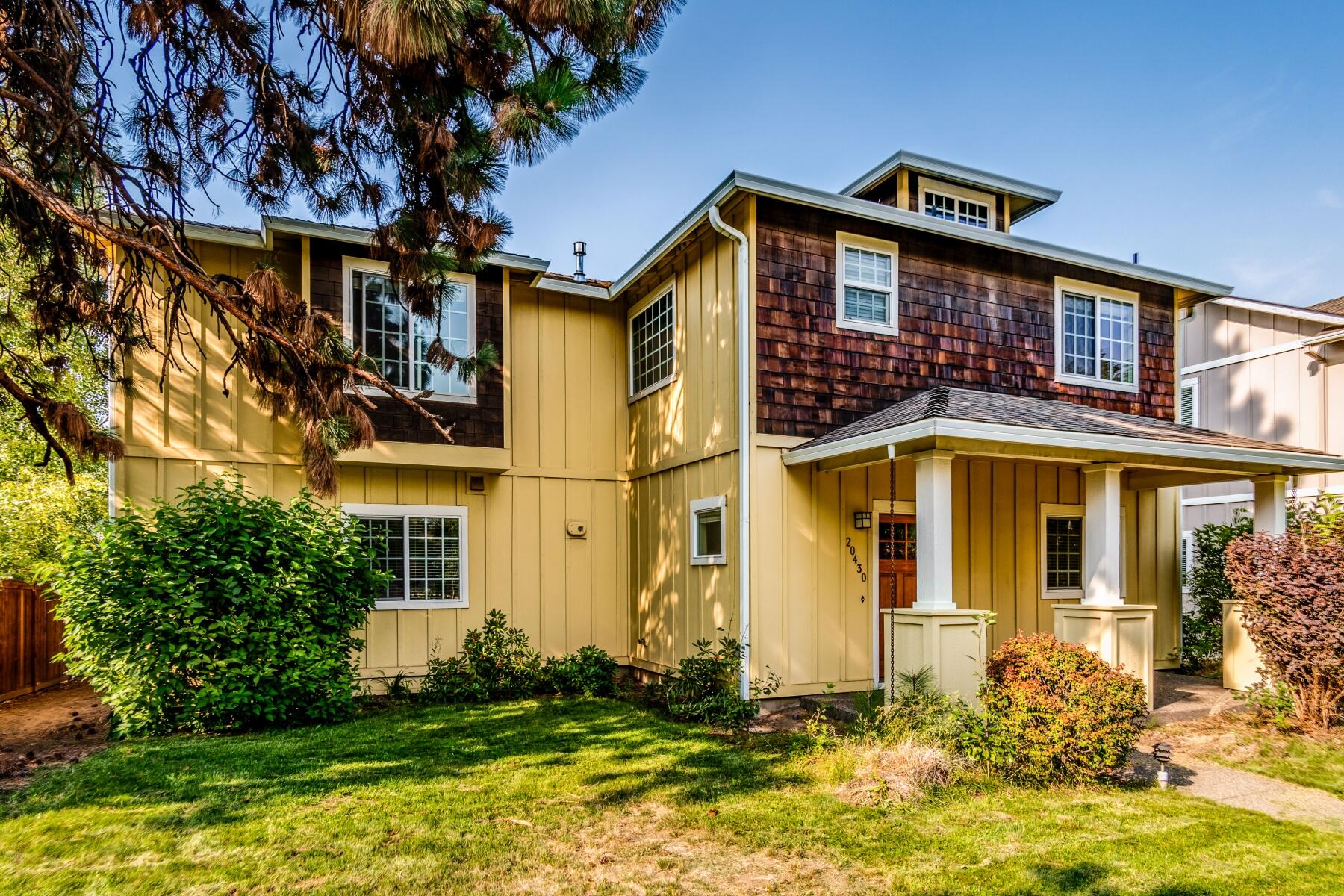 Situated in the heart of SE Bend, this light filled home is the perfect jumping off spot for all of your Bend adventures. Don't let the Murphy address fool you, this house is very quiet inside and actually feels very private as it's set back off the road on a beautiful treed lot. This craftsman style home has it all: 4 bedrooms, a large open concept living room and kitchen and a low-maintenance backyard that is perfect for kids, pets and BBQs. The open concept living room has a gas fireplace, wood floors, a slider to the backyard and is a great place to entertain and enjoy time with family and friends. Upstairs you'll find all the bedrooms including a HUGE bonus room or guest suite (4th bedroom) with ensuite bathroom. You're less than 5 miles to Downtown Bend, and just 3 miles to the Old Mill - close enough to get out and explore all Bend has to offer yet far enough to have your own quiet retreat