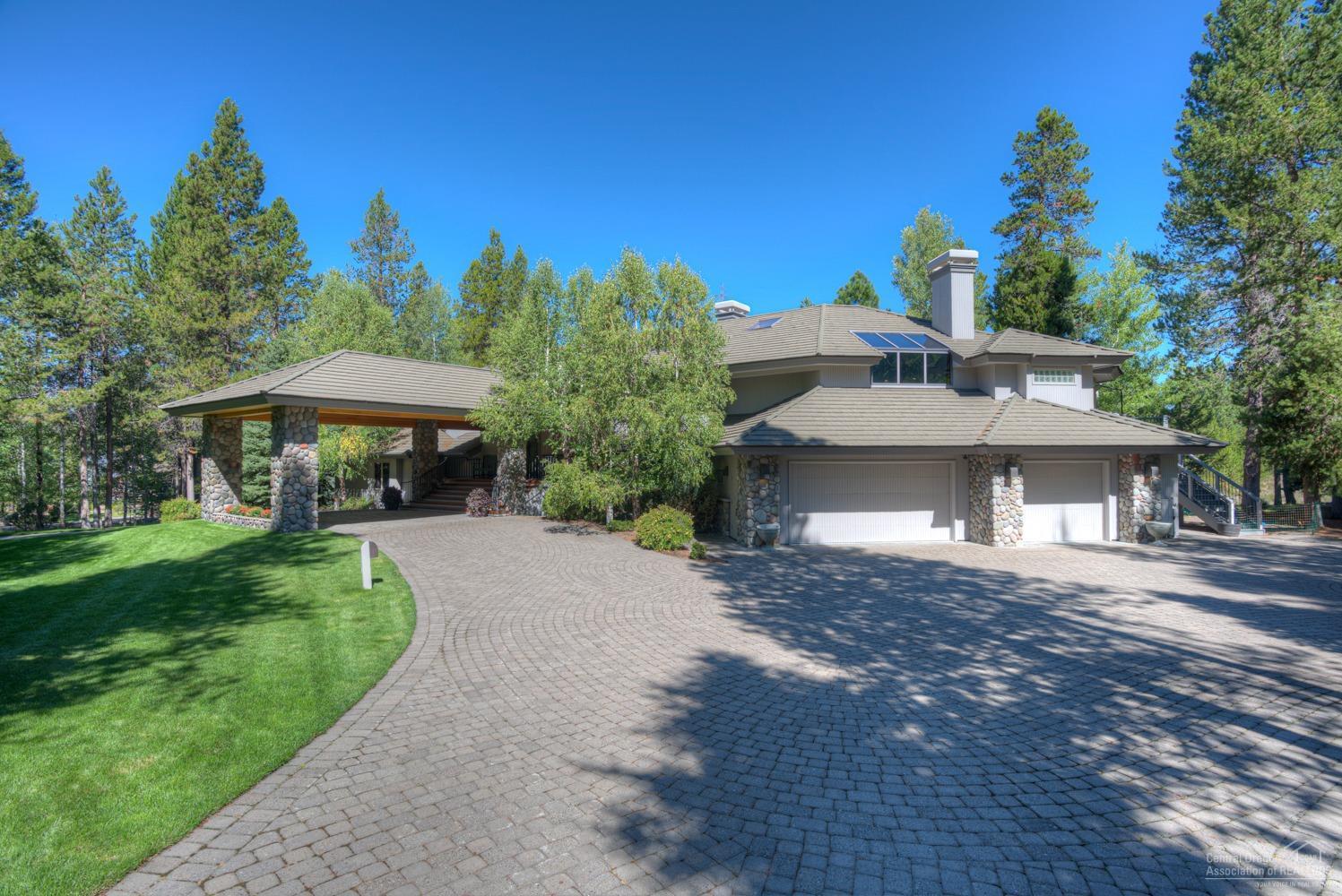 Artisans and designers have left their mark on this outstanding residence, The living room is a show place from floor to ceiling with a travertine wall that surrounds the fireplace The kitchen was recently completely & extensively remodeled & is new in every aspect beginning w/hardwood floors throughout Light colored granite counters next to hand stressed rich wood cabinetry Top of the line stainless steel Wolf range w/6 burners, center grill, two ovens, custom copper hood, built in refrigerator, large second eating area, & much more. The dining room is magnificent w/built-in buffet & 2 art niches The DR has tray ceiling with a silver leaf finish & the dining room is touched off by a 100 year old Swedish porcelain gas stove The master bedroom & bathroom has also been renovated and is a true elegant retreat within the home Generous family room w/fireplace, 2 additional guest rooms, plus large den w/walnut walls & ceilings A work of art Enjoy an over sized triple gar Borders Nat Forest