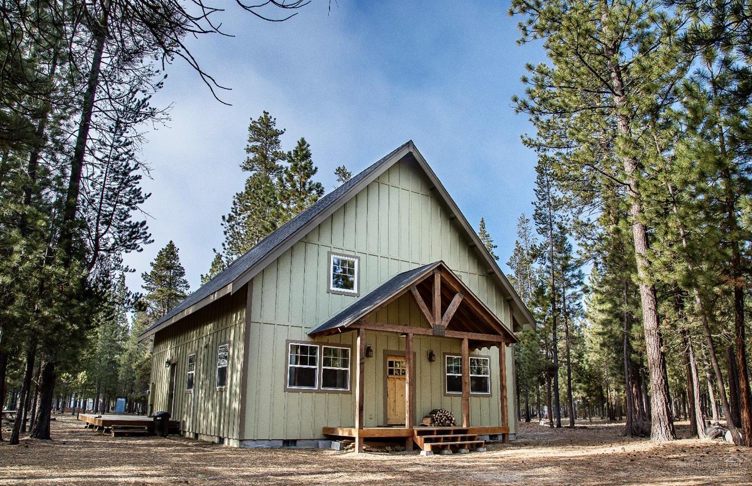 Custom cabin beckons you to a tranquil setting amongst the pines. Home offers open living, hardwood floors, tile & carpet, barn doors, wood burning fireplace, farm sink & SS appliances. Beautiful finishes throughout! 3 bed 2 bath w/ loft bedroom. Recreation abounds w/ rivers, lakes, volcanic attractions & hiking/biking trails right outside your door. Space to build a shop. Lightly used as a vacation home. Make this distinctly peaceful atmosphere your permanent residence or Central Oregon getaway cabin.