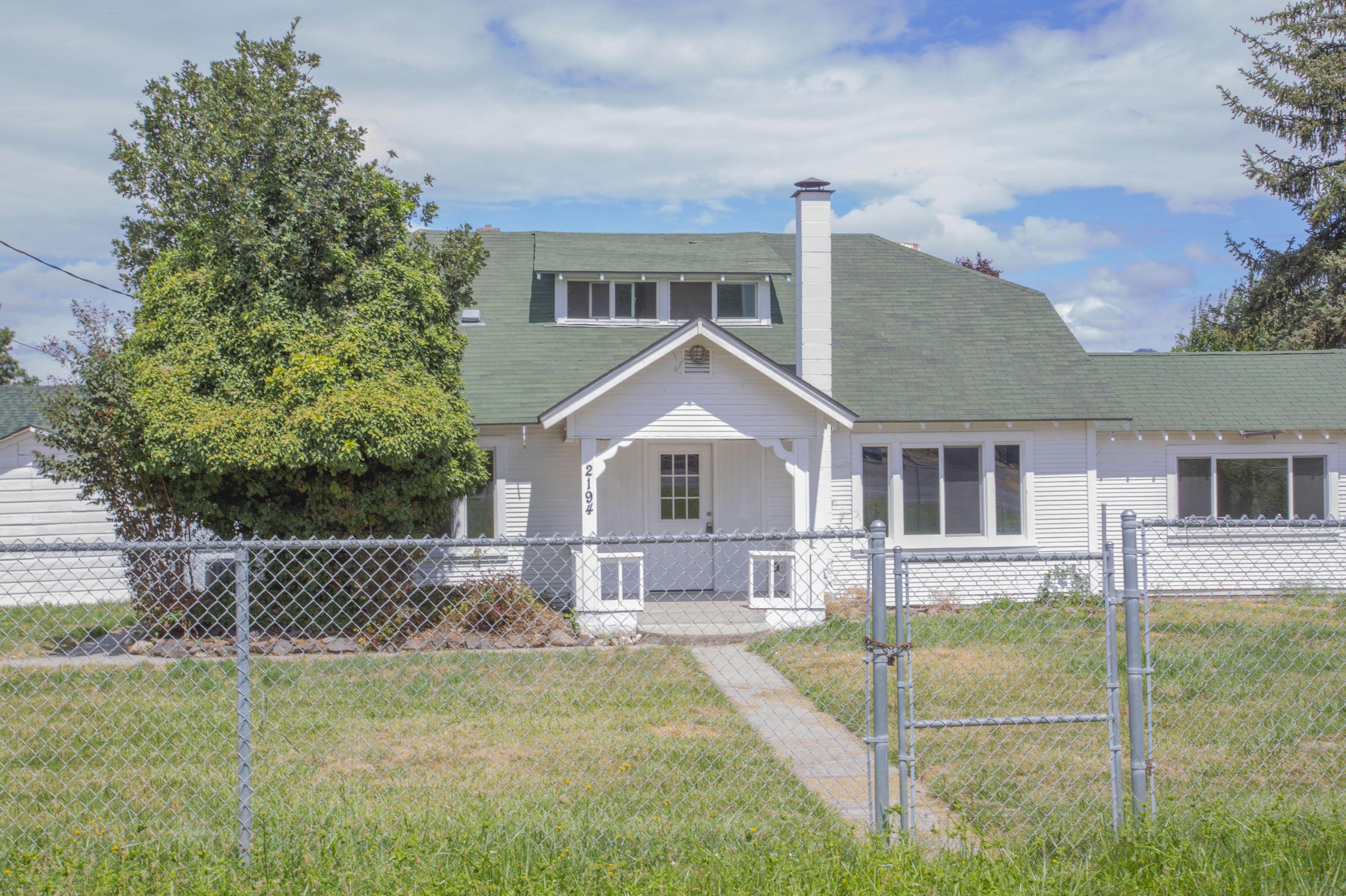 Own your own Southern Oregon two-acre mini farm right in the heart of the Rogue Valley. This home is located on 1.9 pressurized TID irrigated, flat acres with views of the mountains. The home features 2, 100 square feet of space on two floors. Includes four bedrooms, two baths, an upstairs alcove for an office, vaulted ceilings, built in cabinets, farm kitchen with new appliances and original hardwood floors throughout the lower level. Other features, two wells on the property, new septic installed in 2016, Large RV parking area, recently installed A/C unit. The home has been recently updated and is move-in ready for the right buyer. Vacant and easy to show.