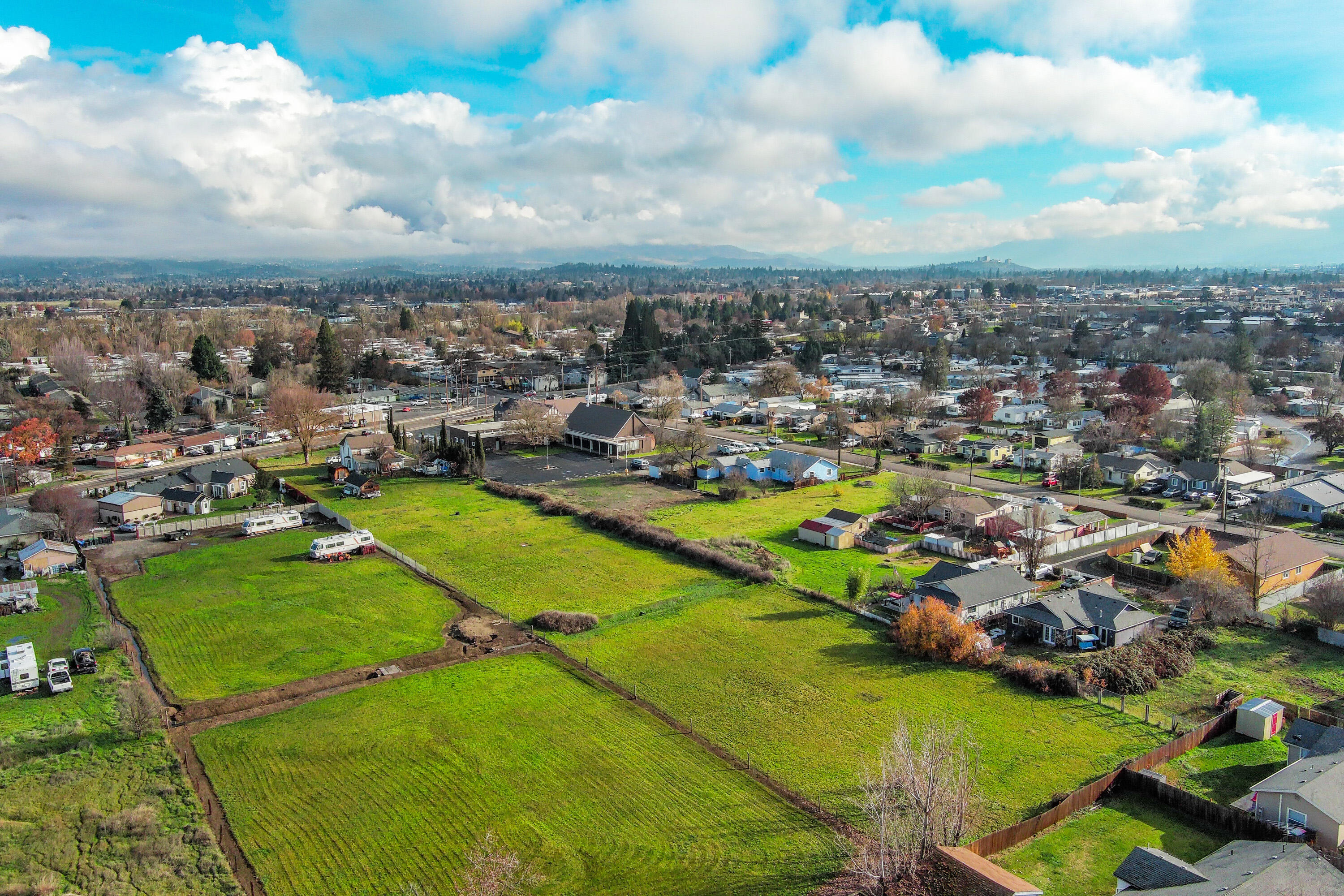 Approximately 2.5 - 3.0 AC of  Development Land for sale.  
Zoned SFR 6. 
Approx; 1.0 AC to be sold with 2605, 2573, 2587 Merriman which combined is approximately 3.0 acres. All properties are contiguous & adjacent and share fence lines running East and West. Chico Street intersects Tennessee St. and abuts to the back of 2 properties. A storm drain is being scheduled through Chico Street to tie in with 1.57 acres to the south of 2573 Merriman. The storm drain will be prepared for future development of the vacant land off Merriman Rd. Buyers to do their own due diligence to determine best use and development of the properties. Addresses are to locate the land behind the houses. Houses on Merriman are occupied and not presently for sale. Call the Listing agent for access through the properties to view the land in the back.