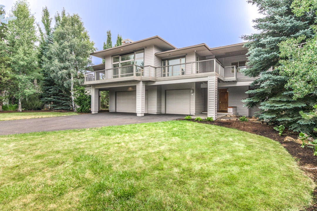 Classic Sunriver design with a hint of modern...Tucked away on quiet Mulligan Lane, this home could be set-up as a luxury rental, a second home get-away or a full-time resident. The home sits on a large (.36 ac.+/-) backing to a private common area with direct access to the walking/cycling path system. A tiled entryway welcomes you into the home on the ground level. High ceilings, even on the lower level, give the home an open feel and the central stairwell faces south with lots of windows to create an atrium-like feel. The lower level has a bonus 
/ media room, a secondary Primary Suite, another full bedroom and another full bath plus access to the three-car garage. As you move up the stairwell, the is small, comfortable deck off of the landing that is perfect for morning coffee. The upper level of the home has a large Great Room w/ wraparound deck, kitchen, utility room, a 1/2 bath, an office/workspace and an oversized Primary Suite. Call you broker for a private showing.