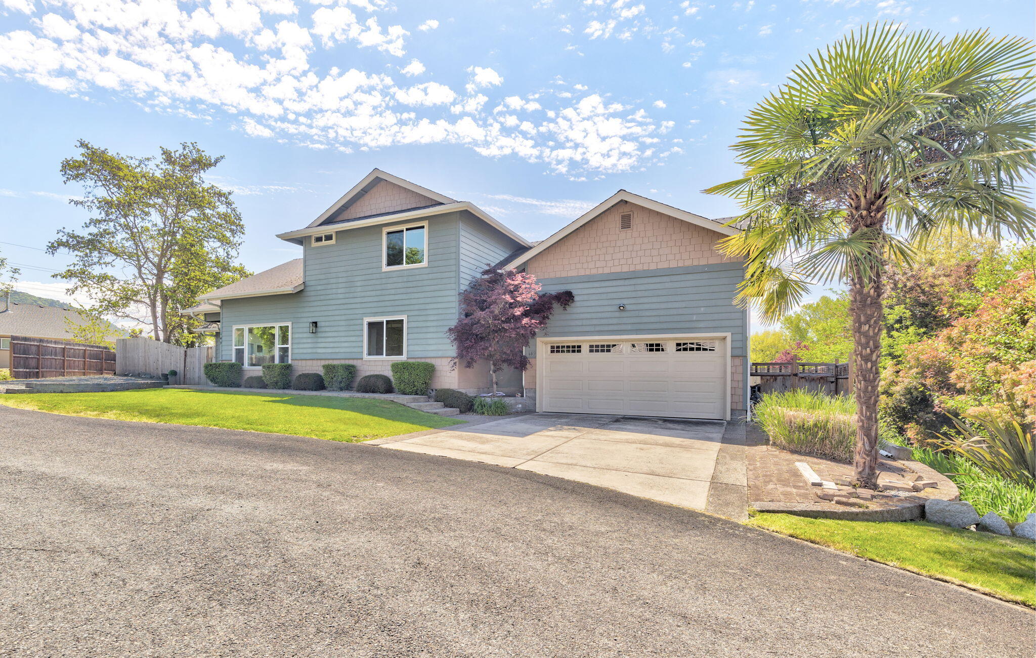 Welcome to sought-after NW Grants Pass living! This beautifully maintained 4 bed, 3 full bath home sits in a quiet cul-de-sac just minutes from local breweries, restaurants, shopping, and medical. Enjoy an open, airy layout with vaulted ceilings, fresh interior/exterior paint, and updated SS appliances. The spacious kitchen flows seamlessly into the living and dining areas, making it perfect for entertaining. The oversized primary suite offers a walk-in closet, dual vanities, and private patio access. Step outside to a fully fenced backyard with a deck and room to garden or play. With a newer HVAC system and  RV parking, this home checks every box. Located within walking distance to top rated schools and beautiful parks, this is the perfect blend of comfort, convenience, and community!