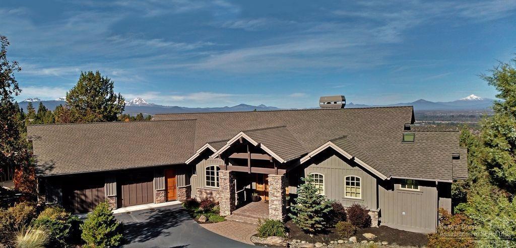 View lot, quality builder, wonderful decorating all combine to create a true masterpiece. Cascade Mt. views from nearly every room, including master on main level. Lovely open floor plan features stone fireplace, built-ins, stunning view windows. Custom craftsmanship featuring wood floors, granite, travertine. Oversized garage, plus additional garage/shop on lower level. Expansive decking with more outdoor living on the lower-level paver-patio, landscaping w/water feature & fireplace. Too much to mention!