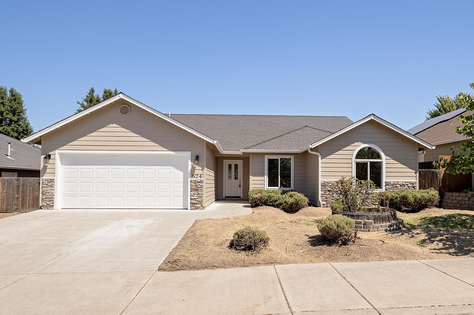 Welcome to this spacious and updated 4-bedroom, 2-bathroom home in the sought-after Barton Hills subdivision of Eagle Point. Built in 2007, this single-level gem sits on a generous lot with a large backyard—perfect for your personal touch or dream landscaping project. Step inside to an open, light-filled layout featuring vaulted ceilings, a split floorplan for added privacy, and a spacious living area with gas fireplace ideal for relaxing or entertaining. The versatile fourth bedroom offers the perfect opportunity for a home office or creative space. The large primary suite includes a walk-in closet, dual vanity, and a spacious bathroom retreat. You'll also enjoy generously sized secondary bedrooms, a dedicated laundry room, and an abundance of natural light throughout. Recent upgrades include BRAND NEW exterior paint, HVAC system, and a new motorized garage door opener—giving you peace of mind and modern comfort from day one! Call for a tour today!