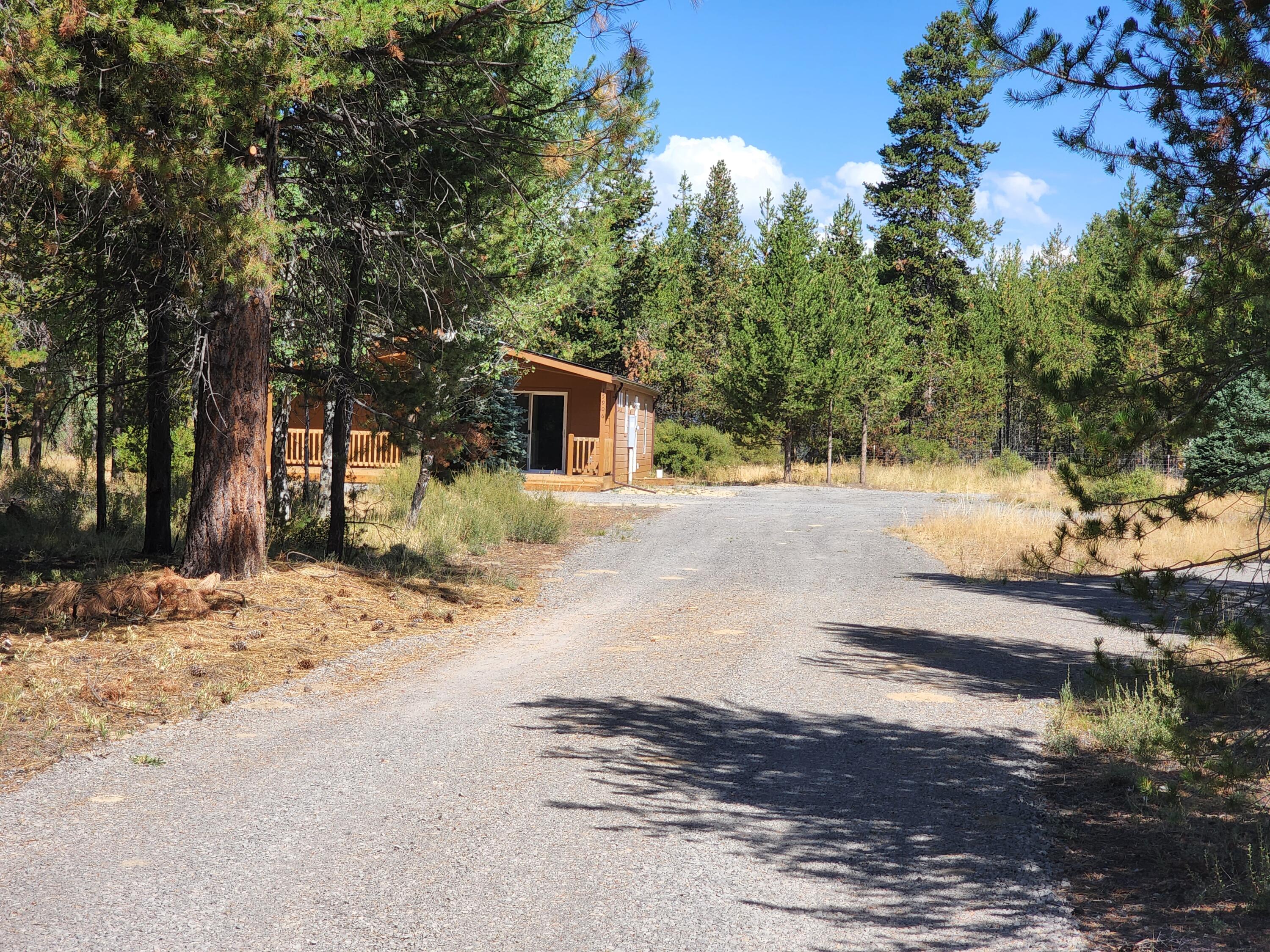 Brand New home in Perfect location at the end of the road, bordering BLM land giving you lots of privacy and the opportunity to watch wildlife from your covered front porch or the huge living room windows. This brand new home is ready to be yours! New well and new ATT septic system, all placed on a lot that has Aspen, Fir, Spruce and Pine trees.  Open floor plan, with lots of upgrades. Room to add a garage and shop down the road. Be sure to check out the plat map showing the 300 plus feet of BLM frontage, where a shop could easily be built and how private the setting is.