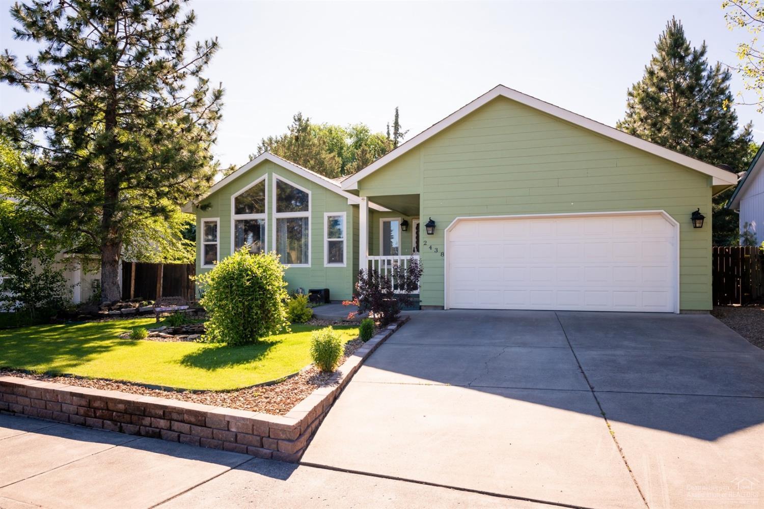 Single level home in Bend's Midtown area!! This three bedroom, two bathroom floor plan offers an open feeling with vaulted ceilings and separate living and family room spaces. The kitchen is built for entertaining family and guest with stainless steel appliances, along with buffet/bar counter seating. The home is comfortable year round with central A/C, gas fireplace, and ceiling fan. The outdoor space is inviting with manicured landscaping on a timed sprinkler system, front porch and water feature pond. The backyard is fully fenced for privacy to enjoy the gas firepit, and is pre-wired for a hot tub/jacuzzi. Just blocks away from Orchard Park and minutes drive downtown and Drake park you are in the heart of Bend!