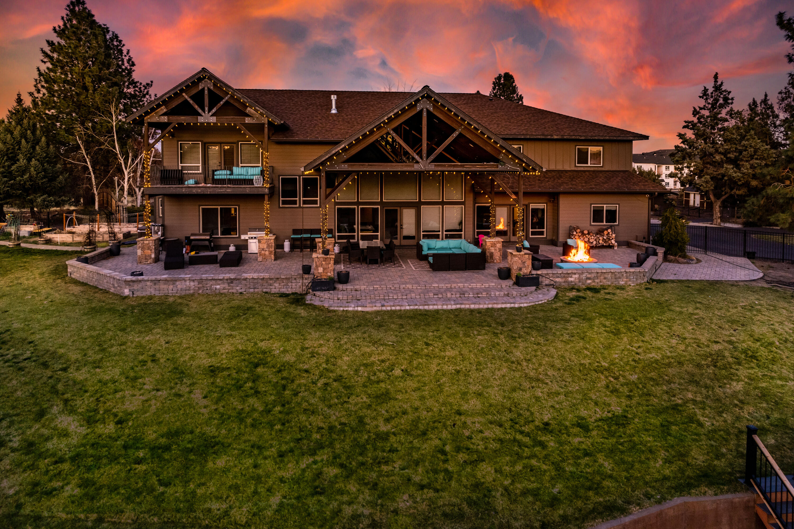This stunning Luxury Estate offers 7,783 sq ft of living and entertaining space that you'll never want to leave!  Located on 3.54 private acres in Bend near Pine Nursery Park, the residence is accompanied by a 7,750 sq ft indoor full sized tennis court, an indoor pool, a flex/shop building and more.

Enjoy the rare park like setting with a zipline and tree swing right next to the  Bend City limits.  The 1.5 acres of irrigation rights let you grow your own vegetables, fruit and more, all while being within a few minutes of all that Bend has to offer.  A wonderful orchard of cherry, apple, peach, pear, plum and apricot trees is already growing for your enjoyment. An equestrian building with 4 stalls and chicken coops allow for flexibility.

Highlighted by high end craftsmanship and featuring beautiful beamwork, stone pillars and custom iron work, the 6 Bedroom, 4.5 Bath Home offers an inviting space.  Game Room, Theater Room, Playroom and Office provide entertainment and space inside.