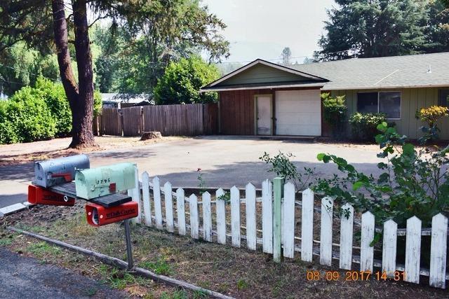 This was a Spectacular Home in it's Day! ...and could be again with your remodeling skills. 2 bedrooms and another bedroom in the converted garage with 2 bathrooms, kitchen and living room. Large 0.4 acre lot with great tree in the back yard. And 2 storage buildings for your hobbies, storage or ???? House is located in the quiet area of Fruitdale Dr below the mountain. The condition is rough, but the price is low, so view it and make an offer....