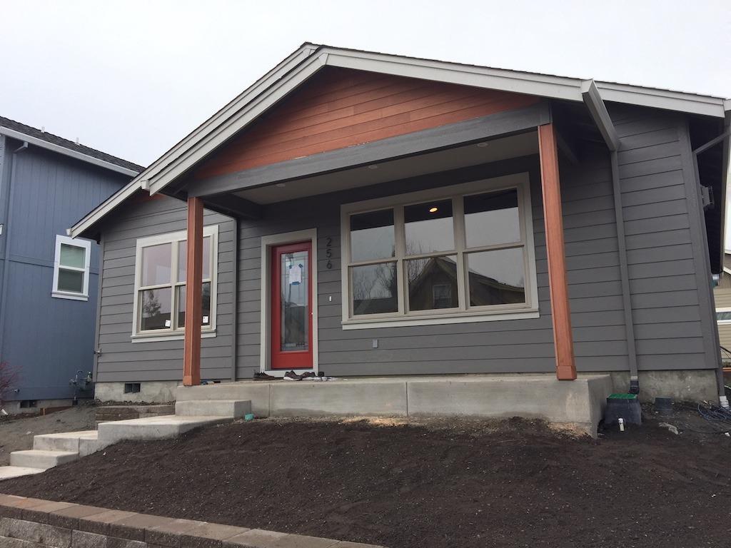 New 2017 green home in Talent! READY TO MOVE IN DECEMBER 12TH, 2017! 1619 sqft. 3 Bdrms, 2 1/2 Baths. Enjoy main-level living w/master bedroom suite, living space, kitchen, bathroom & laundry room all on the main floor. 2 bedrooms and 1 bathroom upstairs. $374,500. mahogany exterior above Hardi-plank siding. The vaulted ceilings will make for a light, bright and open floor plan. White quartz counters, custom tile work, espresso stained cabinetry & ceiling fans are a few if the elegant amenities included. 2-car garage & backyard. This is Earth Advantage Platinum: meaning it will be at least 15-20% more efficient than homes built to 2017 current code. Just having cleaners getting it nice and clean. Located in Old Bridge Village, this home is next to a community park w/ Wagner creek and very close to downtown Talent - shopping, restaurants, cafes and more!