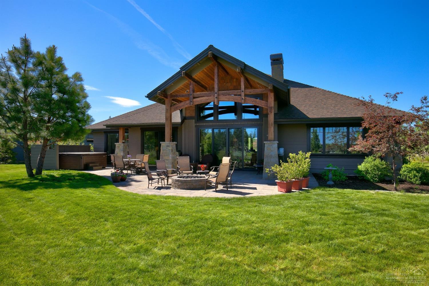 Designed by award-winning Schumacher Construction, this custom single level 3 bedroom plus office 3 bathroom home is spectacular in every way! When you walk into the spacious great room you are instantly given a taste of what this luxurious home has to offer. Picture yourself basking in the beautiful sunlight streaming through your windows as you look out to capture sweeping views of Tetherow's signature par-5 13th hole. As you continue to explore you will notice the gorgeous finishes including a beautiful rock fireplace and a gourmet kitchen perfect for entertaining in style with slab granite surfaces and custom cabinetry. The master suite has a large walk-in closet and beautiful master bath with soaking tub and in-floor heating. Enjoy 3 sets of sliders to allow access to a large paver patio. Imagine relaxing on your deck with awe-inspiring views in your private expansive backyard. Minutes to mountain bike trails at Phil's Trailhead and close to everything Bend has to offer.