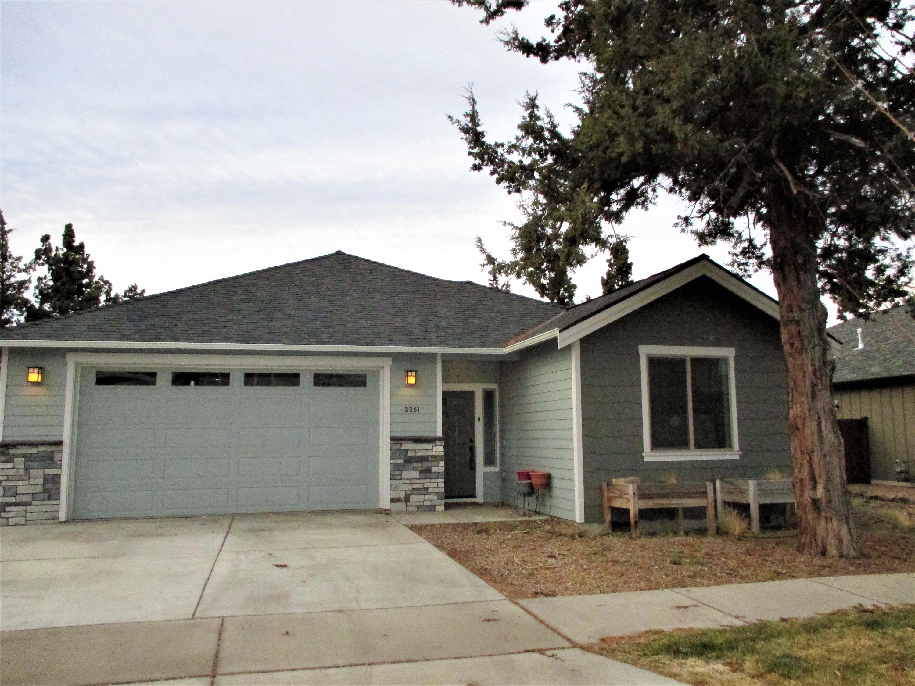 Come See, Come Buy! Top quality construction and finish products in this 1,655 square foot single level home. The vaulted great room boasts a cozy woodstove and a wall of windows looking out to the fenced back yard. Granite countertops, quiet close drawers and a work island are just a few of the highlights in the kitchen. This owner's bedroom and bath includes a French door to the patio, a six foot dual headed tiled shower and two sinks. Two additional guest rooms and bath, with nice separation, located on the other side of the living area. An additional fenced side yard provides room for your RV or boat. All of this tucked into NE Bend. 2015 construction with an easy care, natural scape.