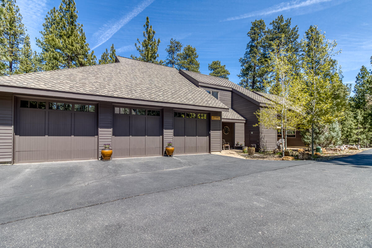 *Motivated Sellers* 
Step into this stunning reimagined custom home, perfectly positioned on a low-maintenance lot with nice views of Black Butte and open common space. The chef's kitchen features high-end appliances, granite countertops, and premium finishes, flowing seamlessly into a vaulted great room with vaulted ceilings. An oversized pantry opens to a covered outdoor cooking area on a durable Ipe wood deck—naturally fire and pest-resistant, ideal for year-round entertaining. The spacious primary suite offers deck access with a private hot tub area, spa-like bathroom with soaking tub, and a very large walk-in closet. The finished lower level includes a game room, bar, and home theater. A 3-car garage offers ample storage, while a bonus room above provides flexibility for an office, gym, or guest suite. Fresh exterior paint and exceptional craftsmanship throughout make this home a rare blend of comfort, luxury, and functionality—ready for your lifestyle.