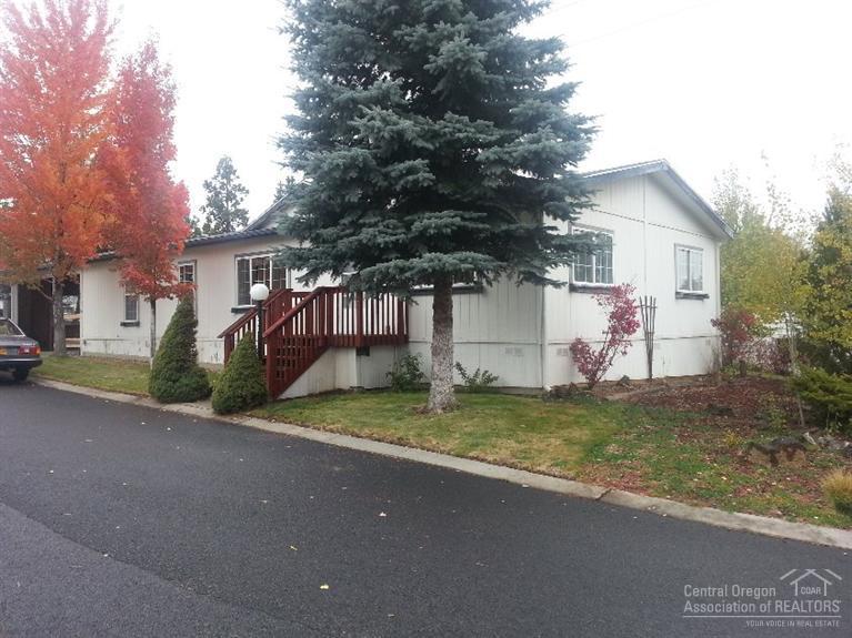 Located in Suntree Village, this mobile only is 1539 sq ft. It has 3br/2ba & an office. It is light & bright w/lots of windows, vaulted ceilings, a large kitchen w/beautiful real wood cabinets, skylight, an eat-in bar & breakfast nook, a large master w/suite w/good separation from other rooms & slider that leads to a deck. 2 car carport, storage/shop.