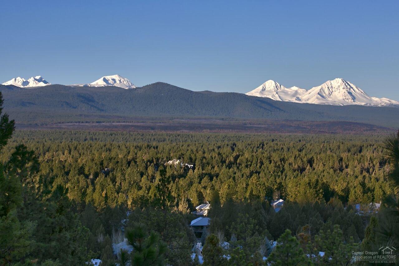 Excellent value at $170/SF on Awbrey Butte. This home features stunning Cascade views & a beautifully designed floorplan throughout. Exquisite light-filled living & dining rms w/ soaring ceilings & elegant fp is ideal for entertaining. Kitchen opens to family rm & offers Caesarstone & lg island & bar. Spacious main level master. Master BA w/ tile floors & 2 walk-in closets. 3 add'l BR on main level. Bonus rm, flex room, wine cellar & massive 5th BR & full BA down. Expansive deck overlooking the mountains.