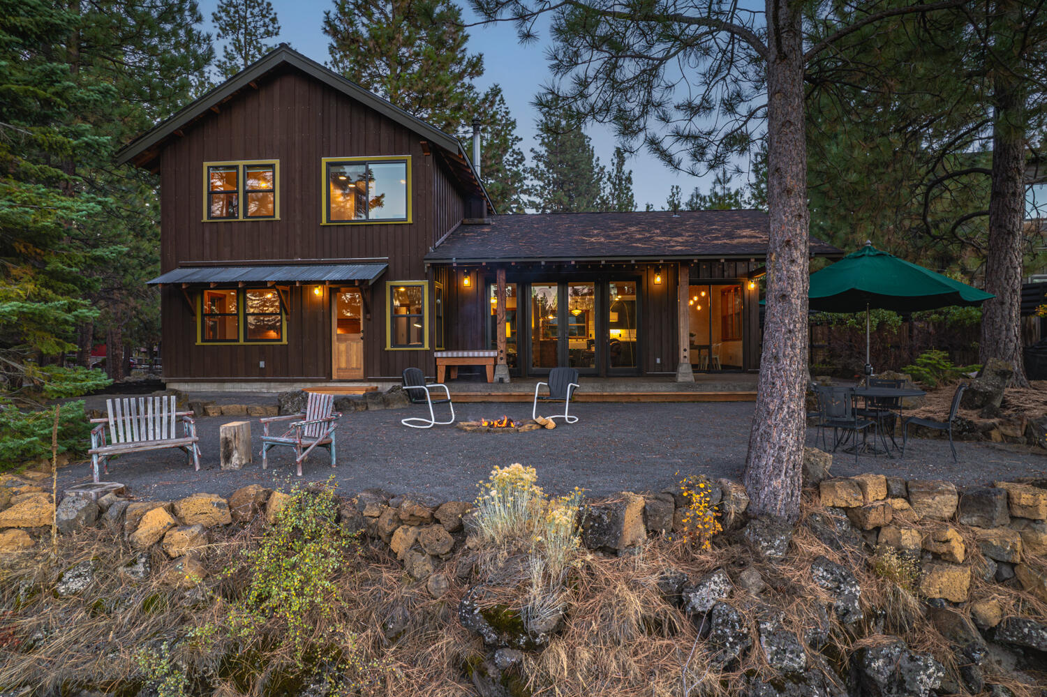 Welcome to your dream home nestled on the rim of the Deschutes River. As the builder's own masterpiece, craftsmanship is evident in every detail. The comfort of radiant flooring, and wood stove that not only provides warmth but creates a cozy ambience. The kitchen adorned with marble tile and butcher block counters, an island for entertaining. The primary bedroom and bathroom situated on the main floor along with half bathroom. On a generous .43-acre lot, a detached 300-square-foot studio beckons with a fully equipped kitchenette and full bathroom, offers endless possibilities , an art studio, a home gym, an office... Venture into the backyard, and sit by the fire or soak in the hot tub nestled in the trees on the canyons edge as you are serenaded but the soothing sounds of the river below while watching the sunset over the Cascades. A short distance through the Deschutes National Forest leads you to a serene eddy where you can venture in for a cold plunge.This sanctuary is a rare gem