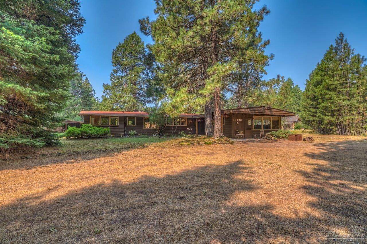 Rustic 2 BR, 1 BA, 1200 sf Camp Sherman cabin w/500+/- sf bunkhouse room''. A great base to explore the beautiful Metolius Basin. Practice your fly cast in the casting pond. Living rm fireplace & dining room wood stove, electric furnace w/heat pump will keep the cabin cozy warm & provides great atmosphere. Vaulted open beam ceilings, bamboo flooring, newly remodeled kitchen & stone masonry. Easy access to trails & Nat'l Forest. Close to summer golf, winter skiing & year round fishing. The perfect escape.