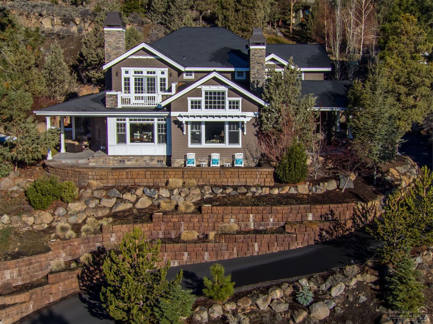 Pay attention to the detail in this fabulous, light‐filled home. Extensive white woodwork includes abundant wainscoting, vaulted master tongue & groove ceiling, gorgeous cabinetry & built ins. The kitchen boast Wolf range/oven, Subzero fridge & white marble island. Guest suite & office on the main; huge master retreat with private deck upstairs plus 2 bedrooms and & bonus. Additional bonus room next to kitchen, fabulous wine cellar & tasting room, 3 + car garage with epoxy flooring & more. Enjoy sunrises & fireworks off the patio equipped with outdoor fireplace. City, golf course and Pilot Butte views round out your back yard entertaining.