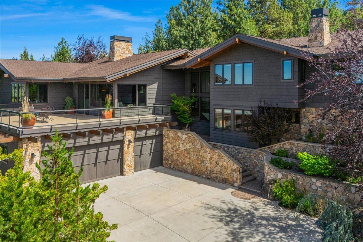 Sellers have dropped the price another $100k. Get it while you can! This is an opportunity to own a private retreat with commanding Cascade Mountain views on Bend's coveted Awbrey Butte where the lots are larger, more private and the stars shine bright.Custom-designed and built by Gary Norman for this .72acre lot, this cedar and stone modern, craftsman showcases exceptional quality — reclaimed solid wood doors, soaring tongue-and-groove ceilings, and a striking wood-burning fireplace. Every window frames nature. With 5 ensuite bedrooms, an office, and two expansive patios, one with an amazing natural rock waterfall, this home flows seamlessly for living and entertaining in all seasons. A heated driveway, oversized garage, whole-house humidifier, and air filtration, and abundant storage add comfort and convenience. Backing to trails and surrounded by wildlife, this rare property blends Bend's outdoor beauty with timeless craftsmanship. Close to shops, schools, golf, and 
Mt Bachelor.