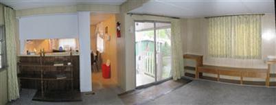 BARE-BONE BARGAIN! This 2 bedroom, 1 bath single wide is tucked under the pines at Siskiyou Village. The living room sports a tip-out for additional living space. A step-saver kitchen has everything in reach & still has room for a table by the windows. Cook-top is gas & the refrigerator is newer. Main bedroom is in the back with room enough for a queen bed. Awnings on both sides of the tip-out provide shade for the front porch & cover for the back steps. The roof is 7- 8 years old & the water heater & furnace are newer. Here's your diamond in the rough. Inexpensive Ashland living!