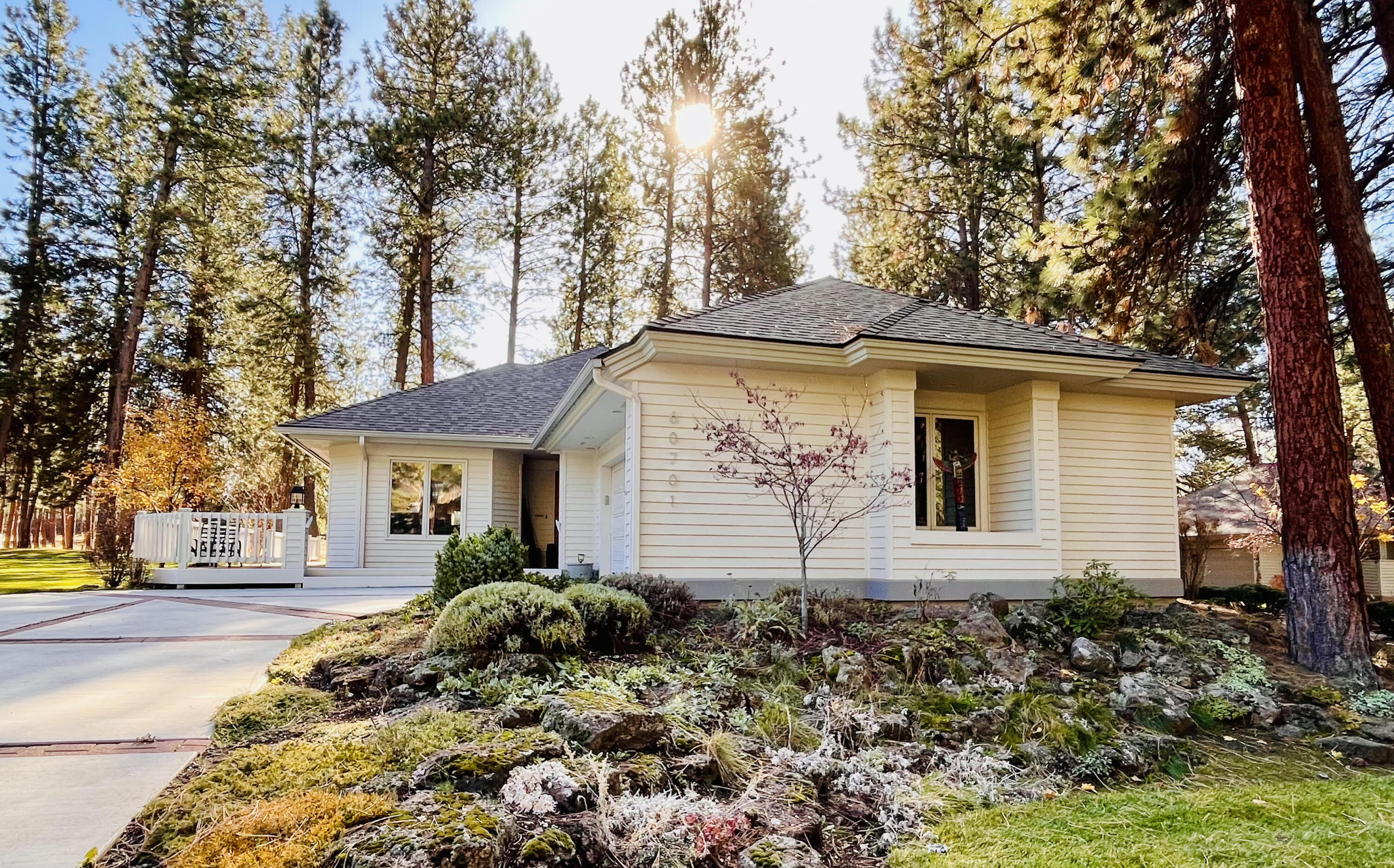 Beautifully remodeled single-level home in coveted Mountain High! Extensively updated in 2017—including the kitchen, acacia hardwood floors, tile, roof, and HVAC—this 2-bedroom, 2-bath residence offers 1,879 SF of refined living on a large .22-acre corner lot bordering community open space for added privacy. Enjoy seamless indoor-outdoor living with a spacious wraparound deck that extends around three sides of the home. Interior highlights include wood-wrapped casement windows, quality finishes, and no carpet throughout. Located in a gated community with premium amenities: golf, pickleball, pool, tennis courts, and clubhouse. HOA covers all yard maintenance and snow removal, offering a truly low-maintenance lifestyle.