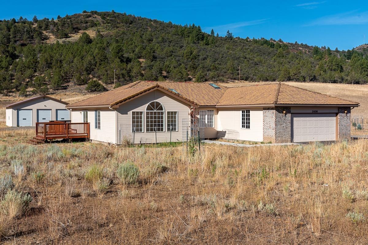 3.15 acres only 2 miles from downtown. This 3 bedroom, 2 full bath home features an open layout and an abundance of windows for natural light. Attached two car garage and a large detached 3 door shop, new HVAC and septic systems, fresh exterior and interior paint, vaulted ceilings and a deck for BBQ's and entertaining. Minutes from Sky Lakes Medical Center and OIT.