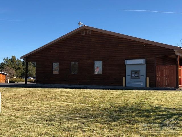 Excellent location on Hwy 97, high traffic area, great visibility, attractive & inviting building, great street appeal. Plenty of parking, nice landscape w/timed sprinkler system that is on a well. Great signage already in place. Entrance from north and south of building. Has previously been a bank, has a large vault with 10'' cement and steel door. Locking safe inside vault and a small safe next to drive up window. The building has 3 offices, a large conference room area and 1000 sq ft main area.